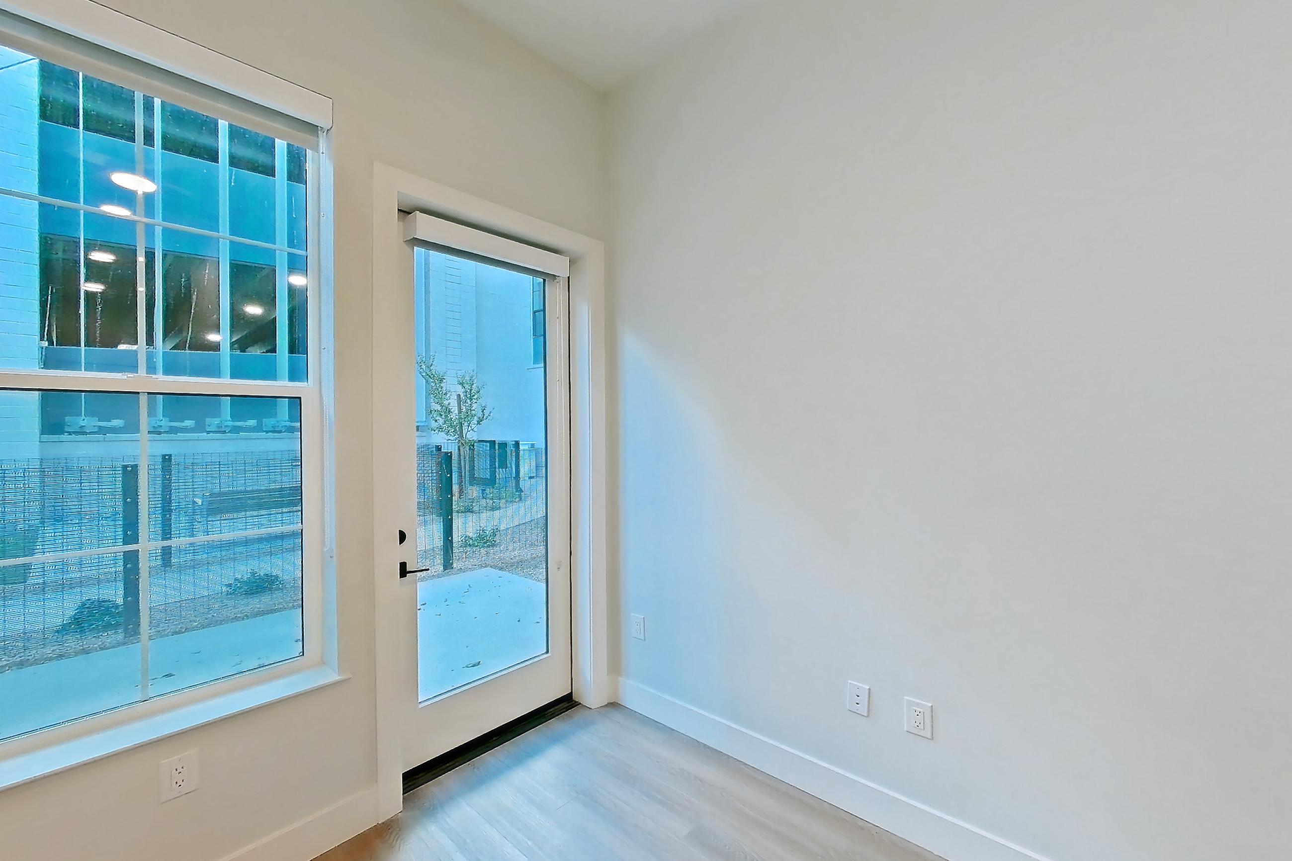 Living room with light wood-finish flooring, Apartment 121 at Bria