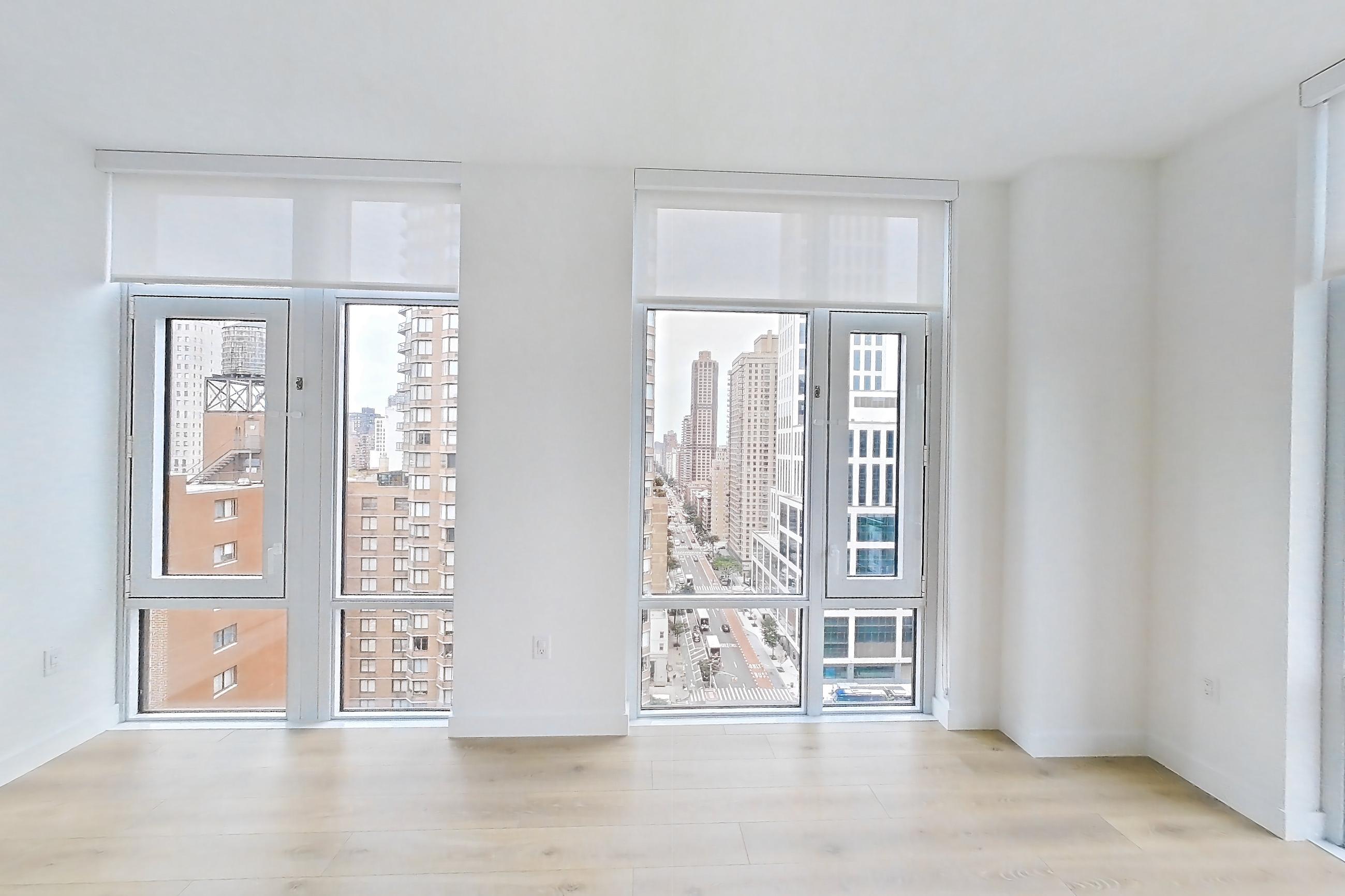 Living room with city view, gas cooktop, and light wood-finish flooring, Apartment 19B at Maison 78