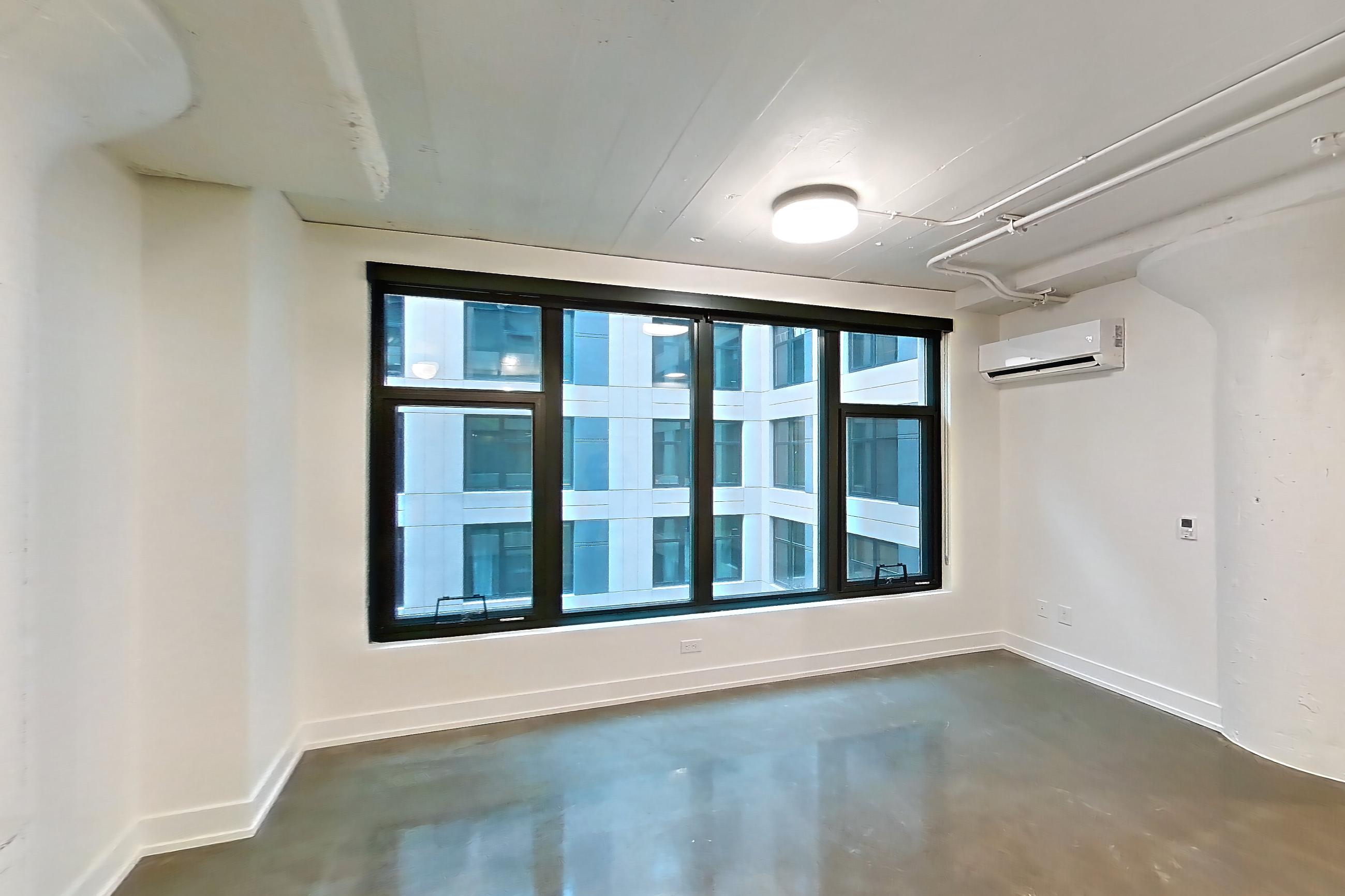 Entryway and kitchen, Apartment 432 at The Hall Lofts