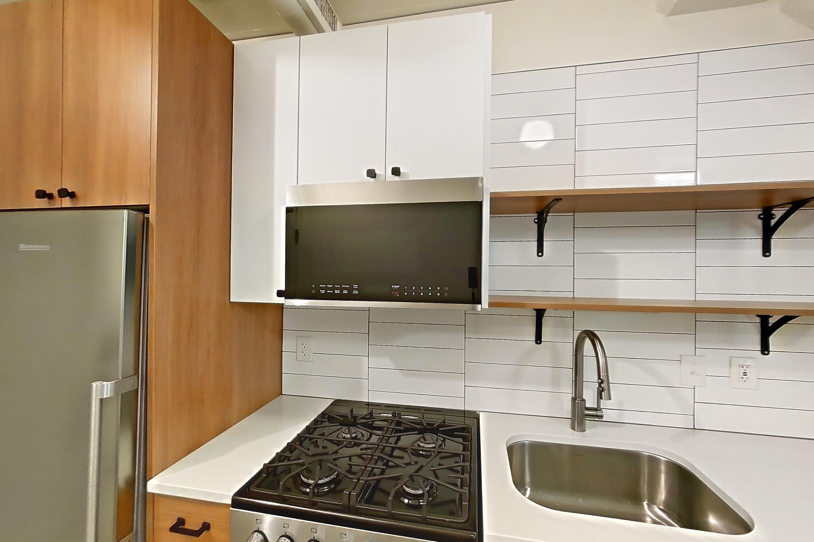 Entryway and kitchen, Apartment 432 at The Hall Lofts