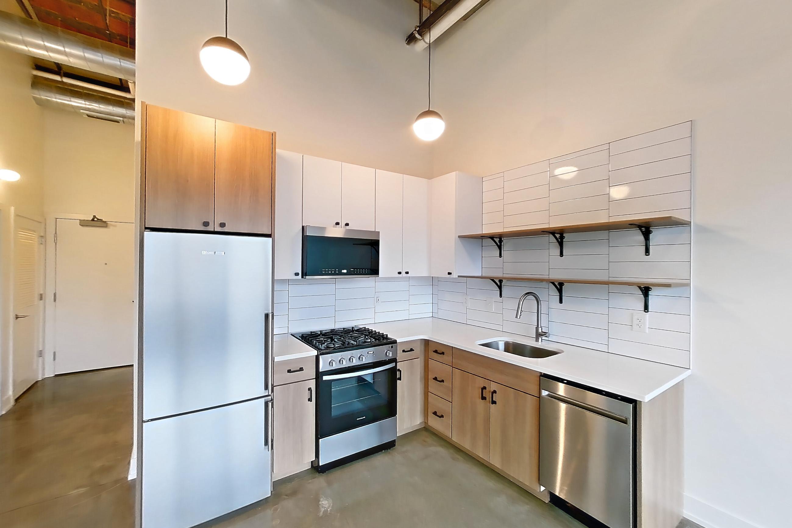 Living room and kitchen, Apartment 841 at The Hall Lofts