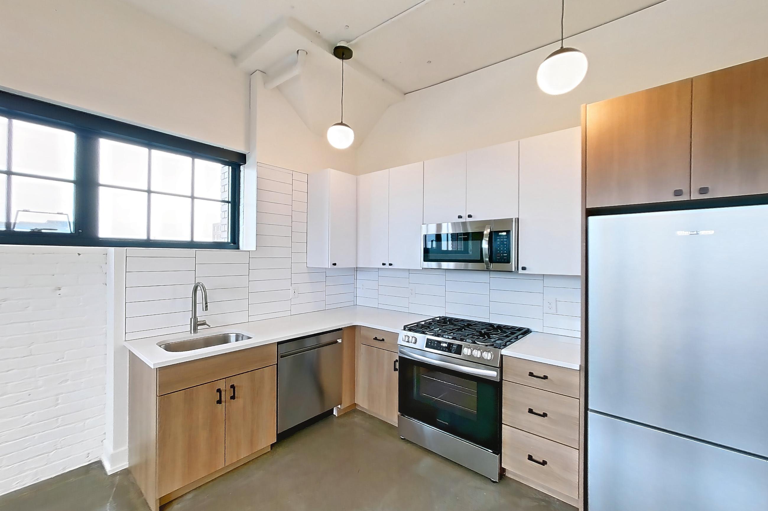 Living room and kitchen, Apartment 857 at The Hall Lofts