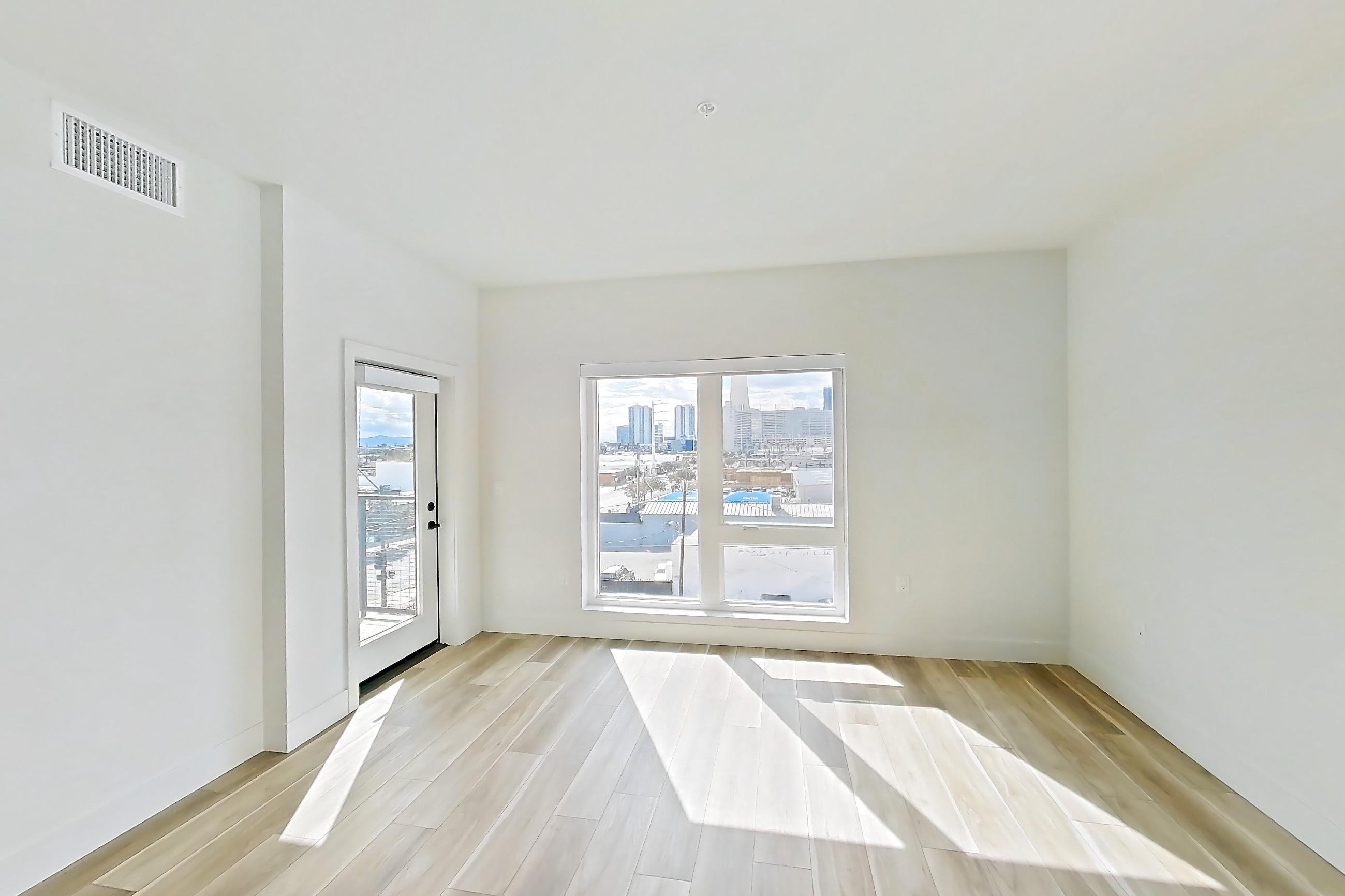 Living room with wood-look tile flooring, Apartment 433 at The Myles