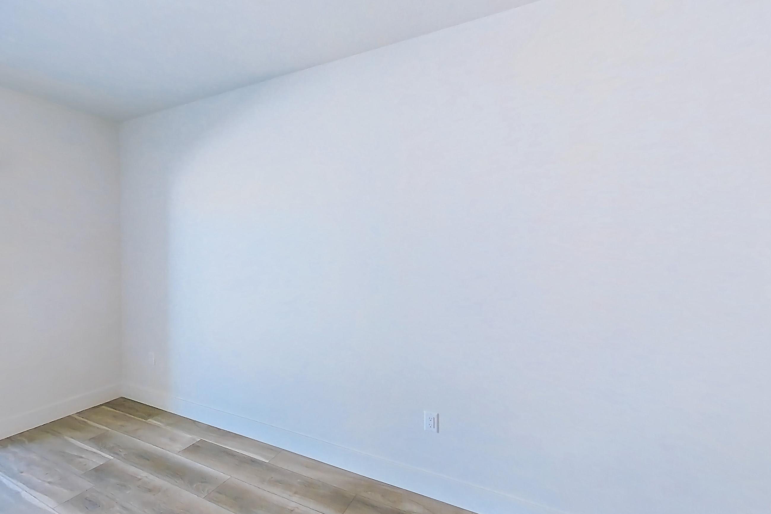 Living space with light wood-finish flooring, Apartment 510 at The Myles