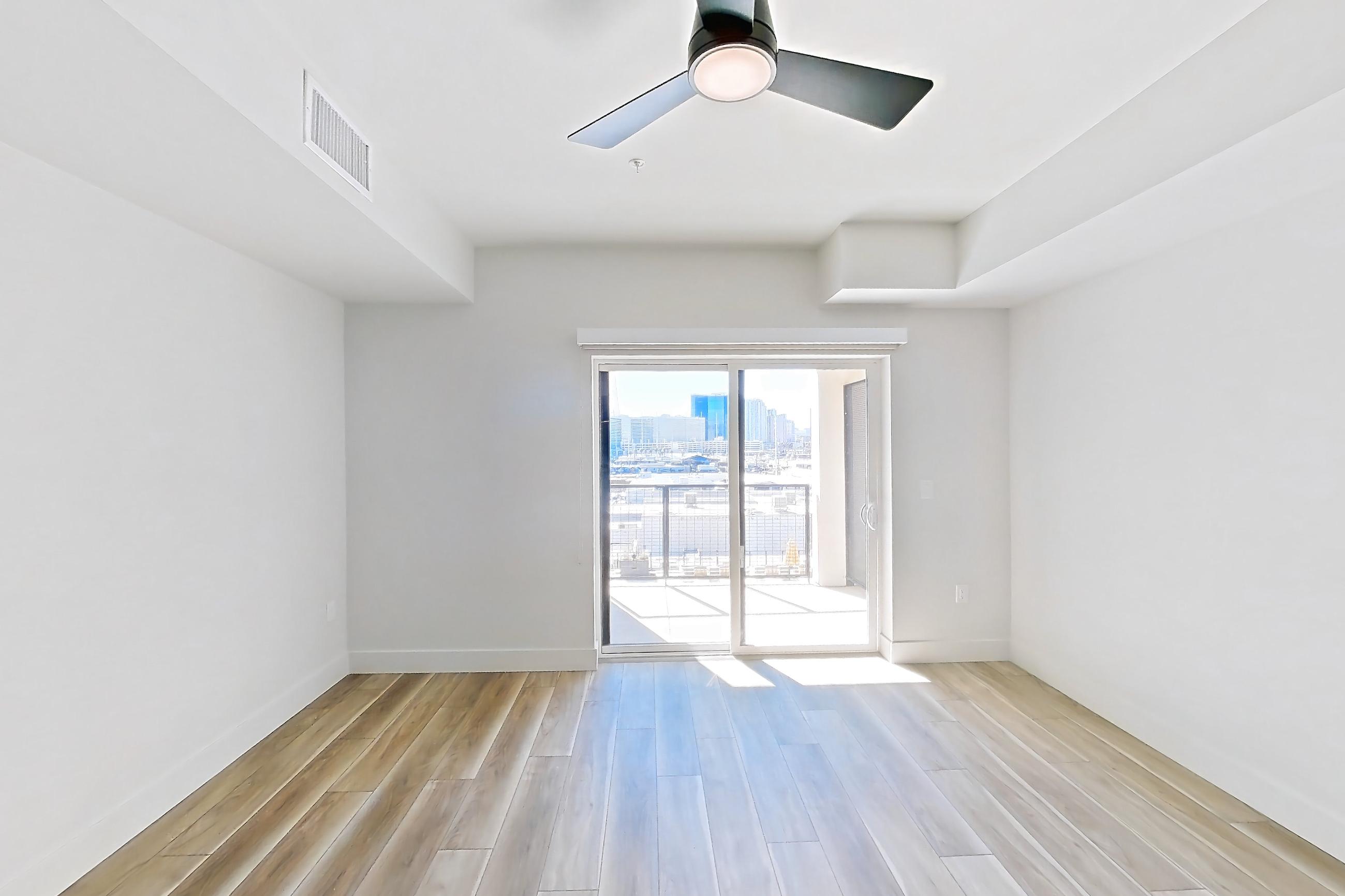 Living space with light wood-finish flooring and wood-look tile flooring, Apartment 519 at The Myles