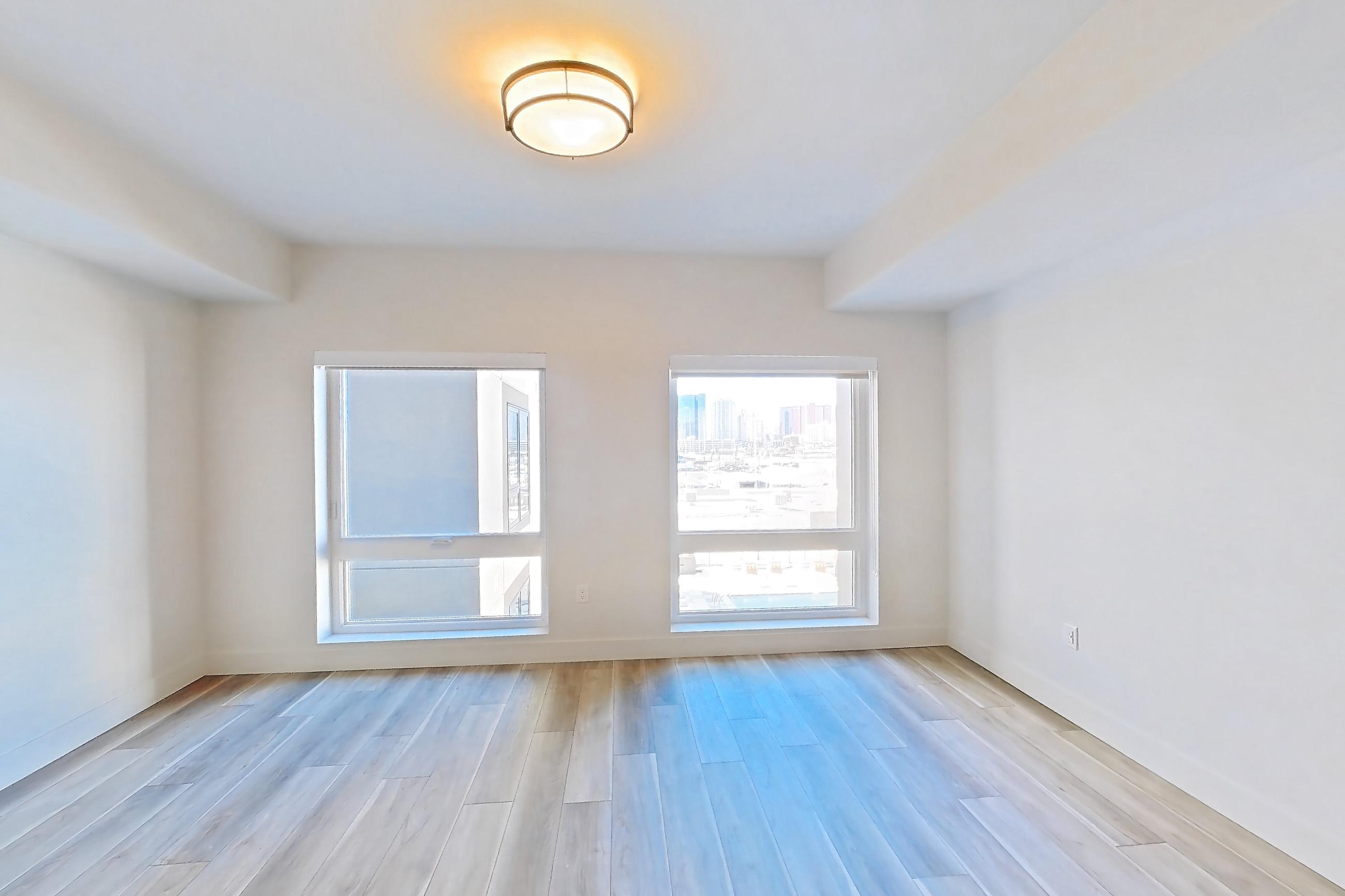 Living room with light wood-finish flooring and wood-look tile flooring, Apartment 521 at The Myles