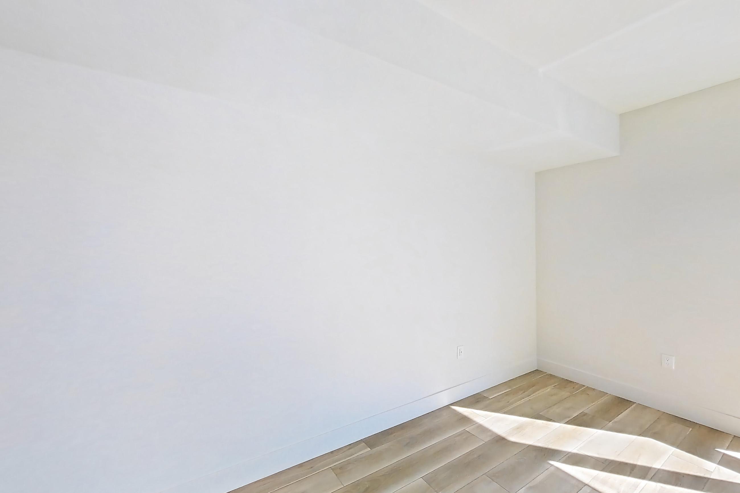 Living space with light wood-finish flooring and wood-look tile flooring, Apartment 526 at The Myles