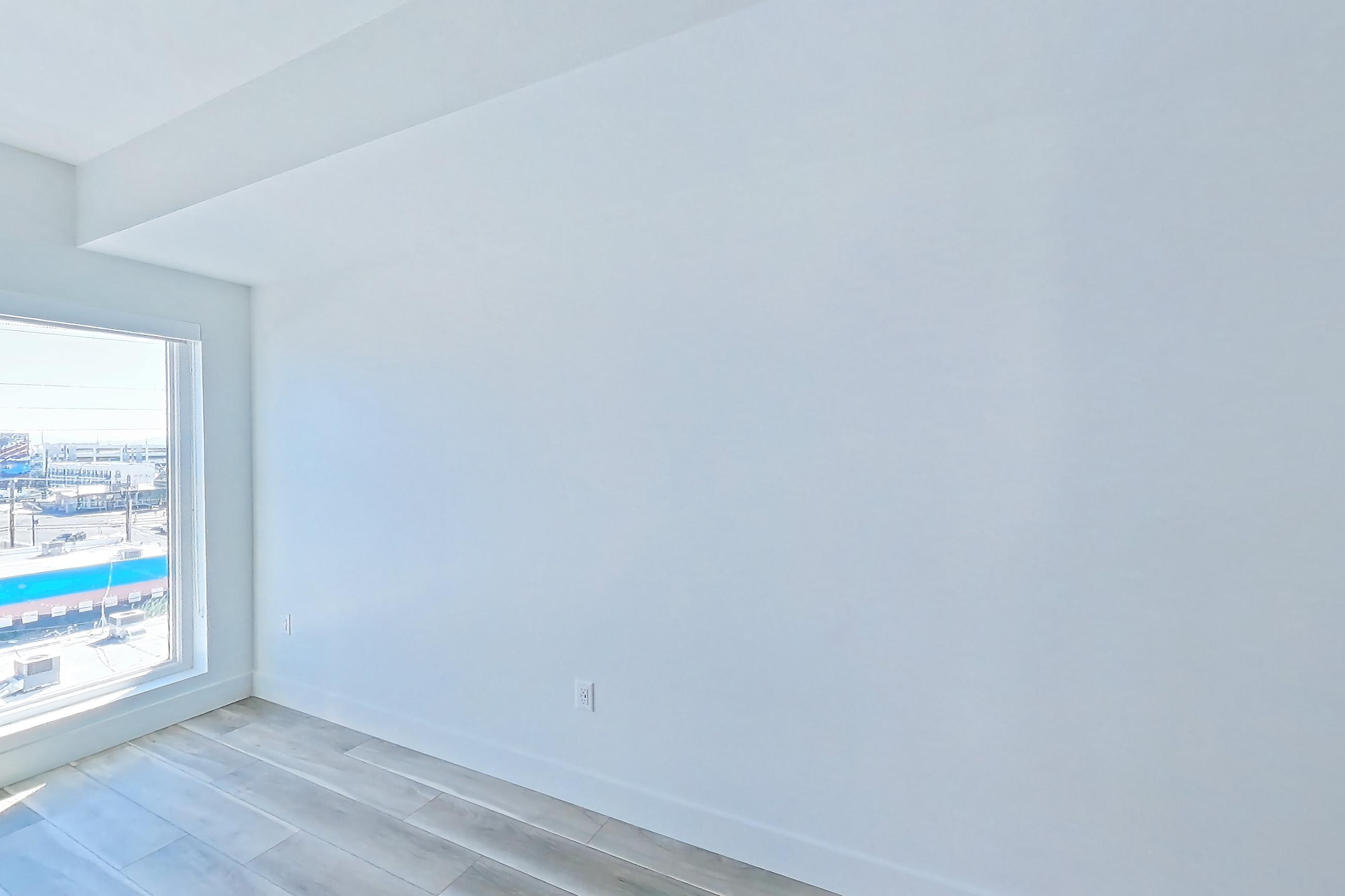 Living space with light wood-finish flooring and wood-look tile flooring, Apartment 528 at The Myles