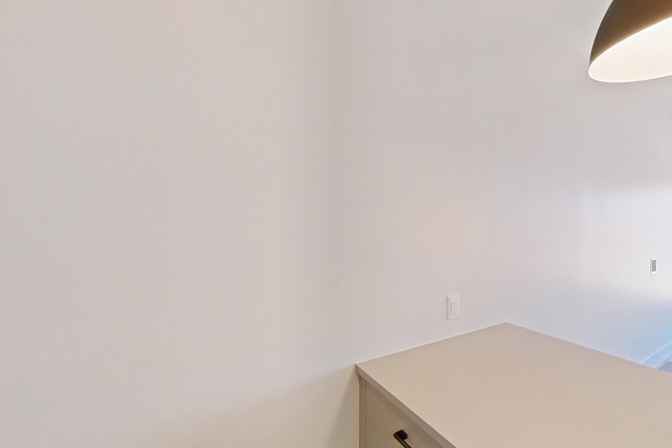 Kitchen with dishwasher, gas range, light countertops, light wood-finish flooring, oven/range, refrigerator, and stainless steel appliances, Apartment 755 at The Myles