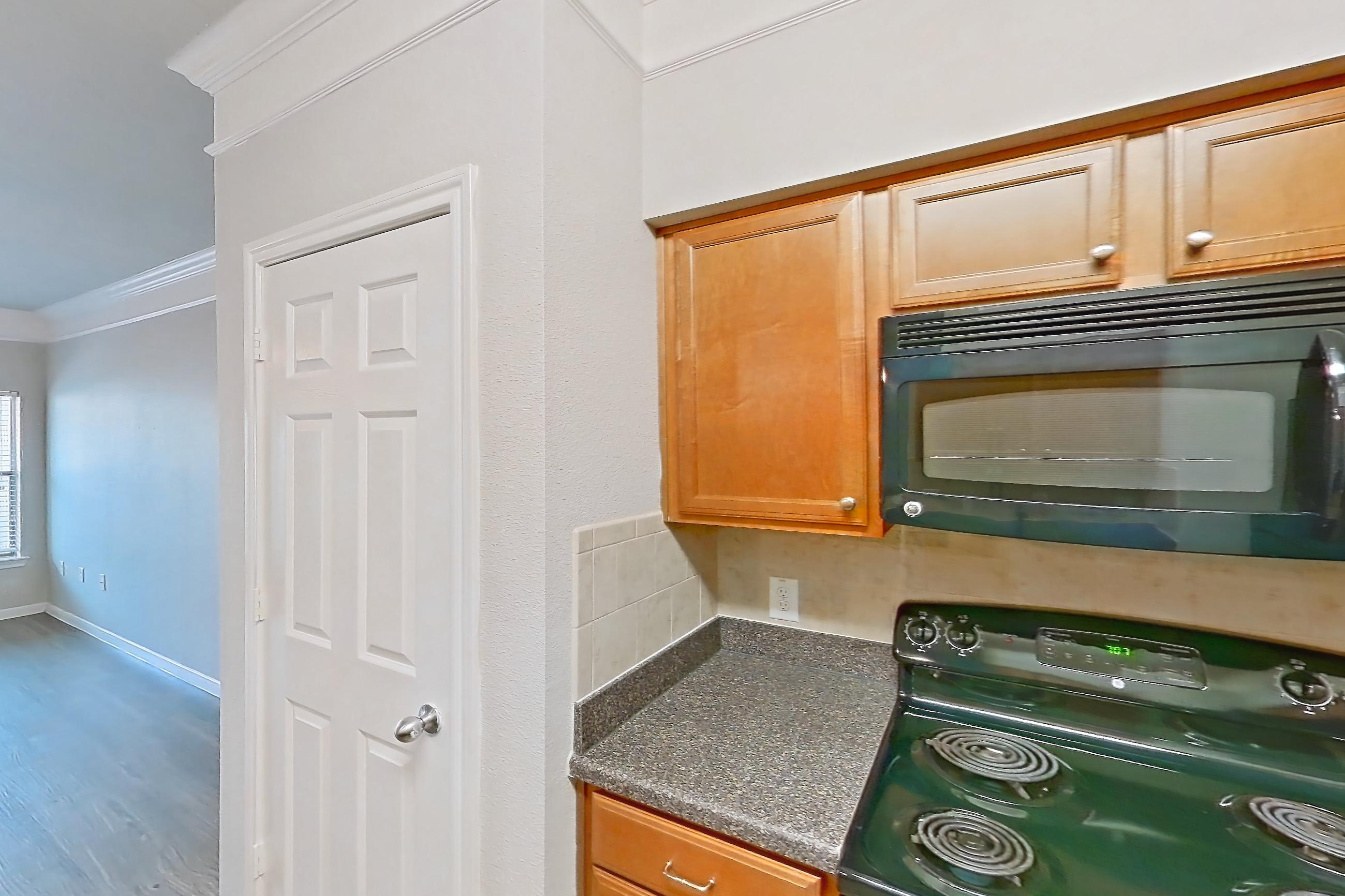 Kitchen in Apartment 7305 at Terraces at Fall Creek, A1 floor plan