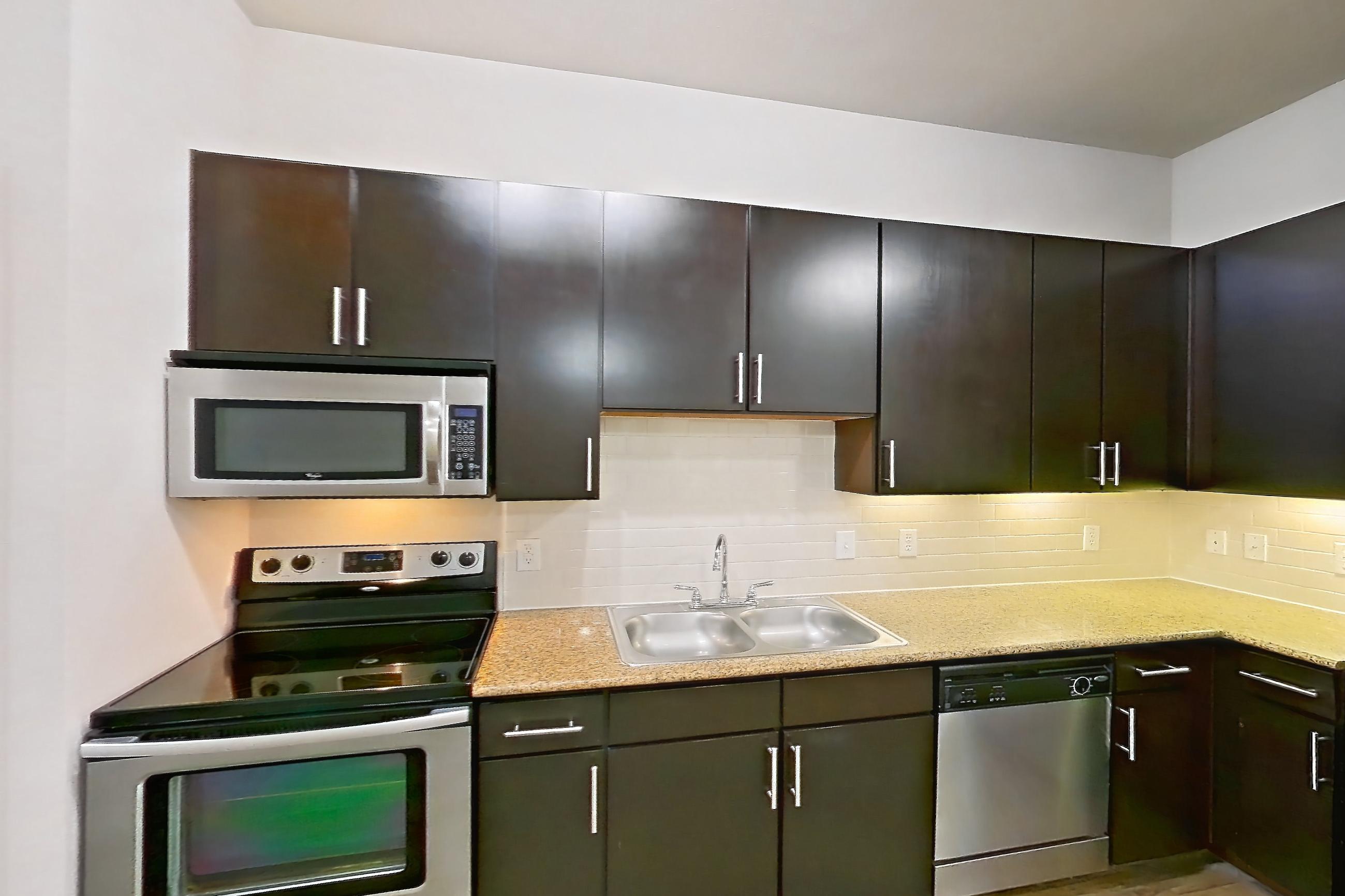 Kitchen space in Apartment 140 at Voyager at the Space Center, A02 - The Shepard floor plan