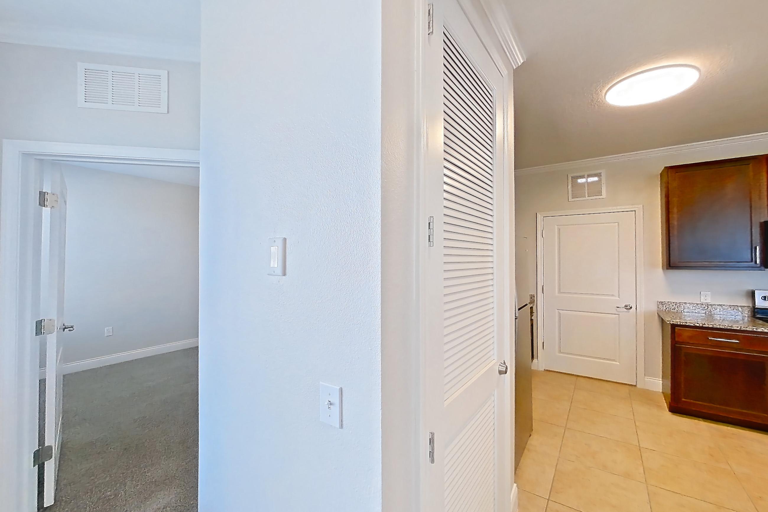 Living space with electric range, microwave, oven/range, and stainless steel appliances, Apartment 0525 at Lake Nona Water Mark