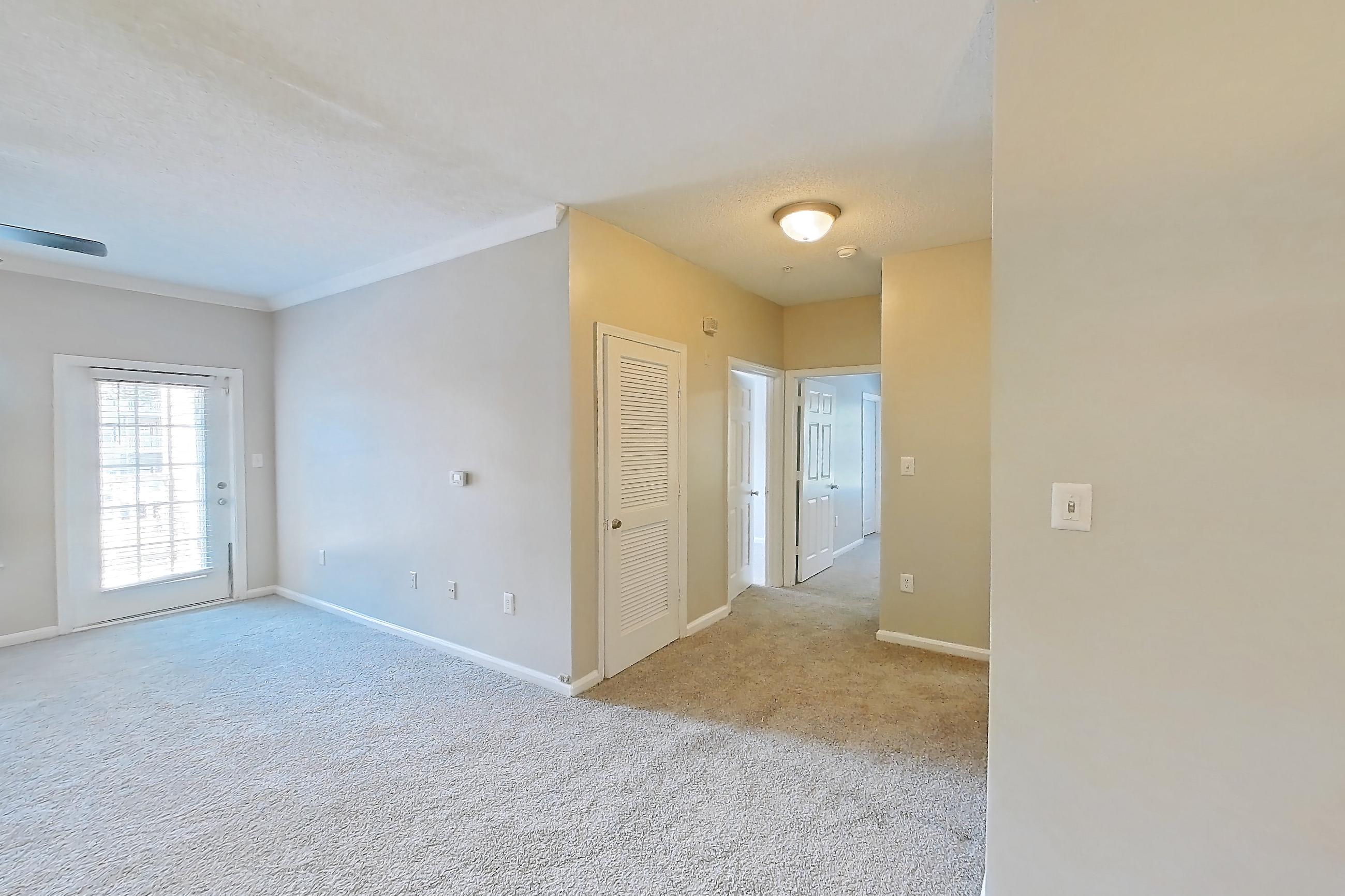 Dining room with light carpet, Apartment 211 at Walden Landing