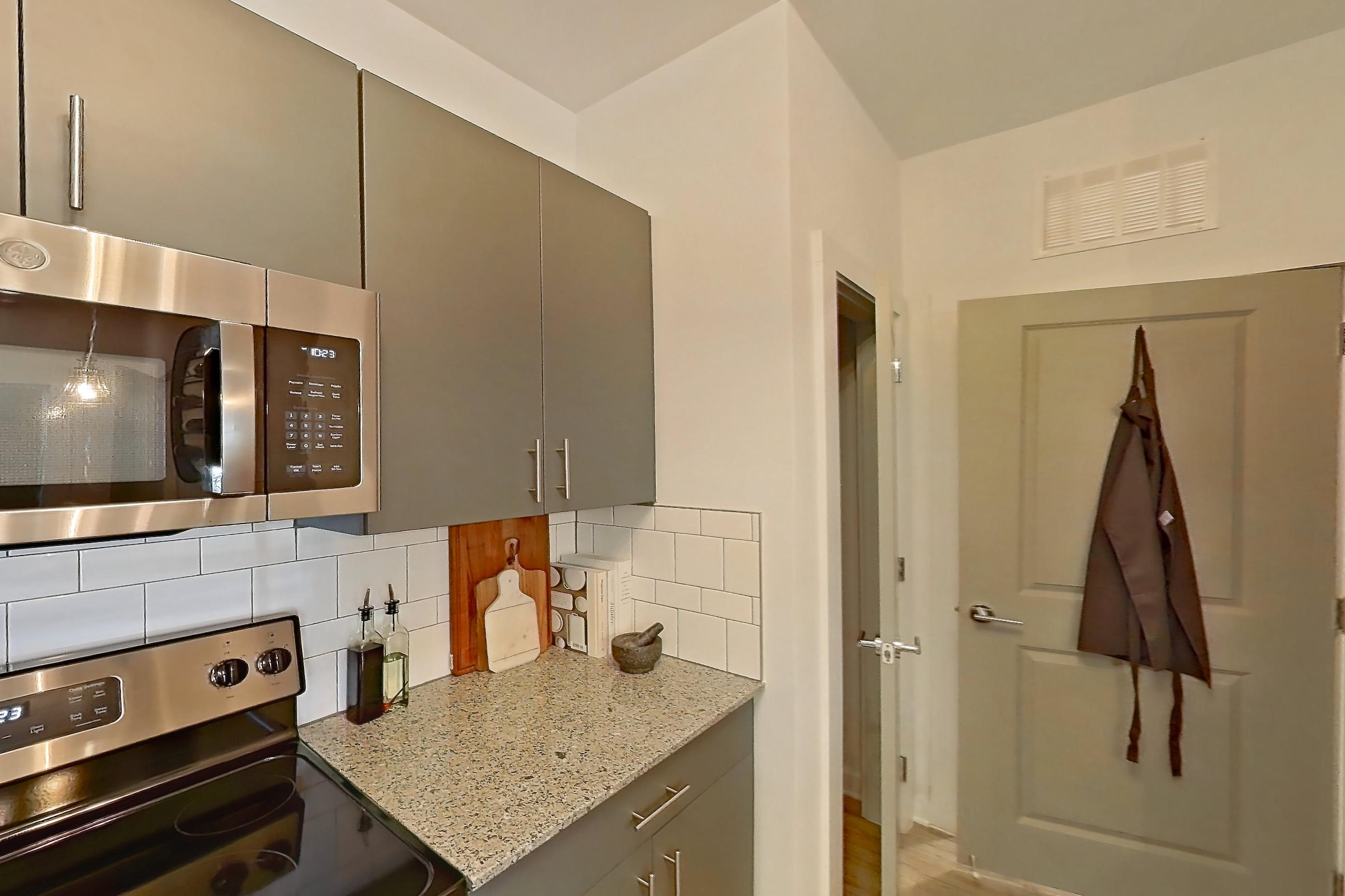 Kitchen in Apartment 1211-102 at Avril Cambridge Village, One Bedroom, One Bath floor plan