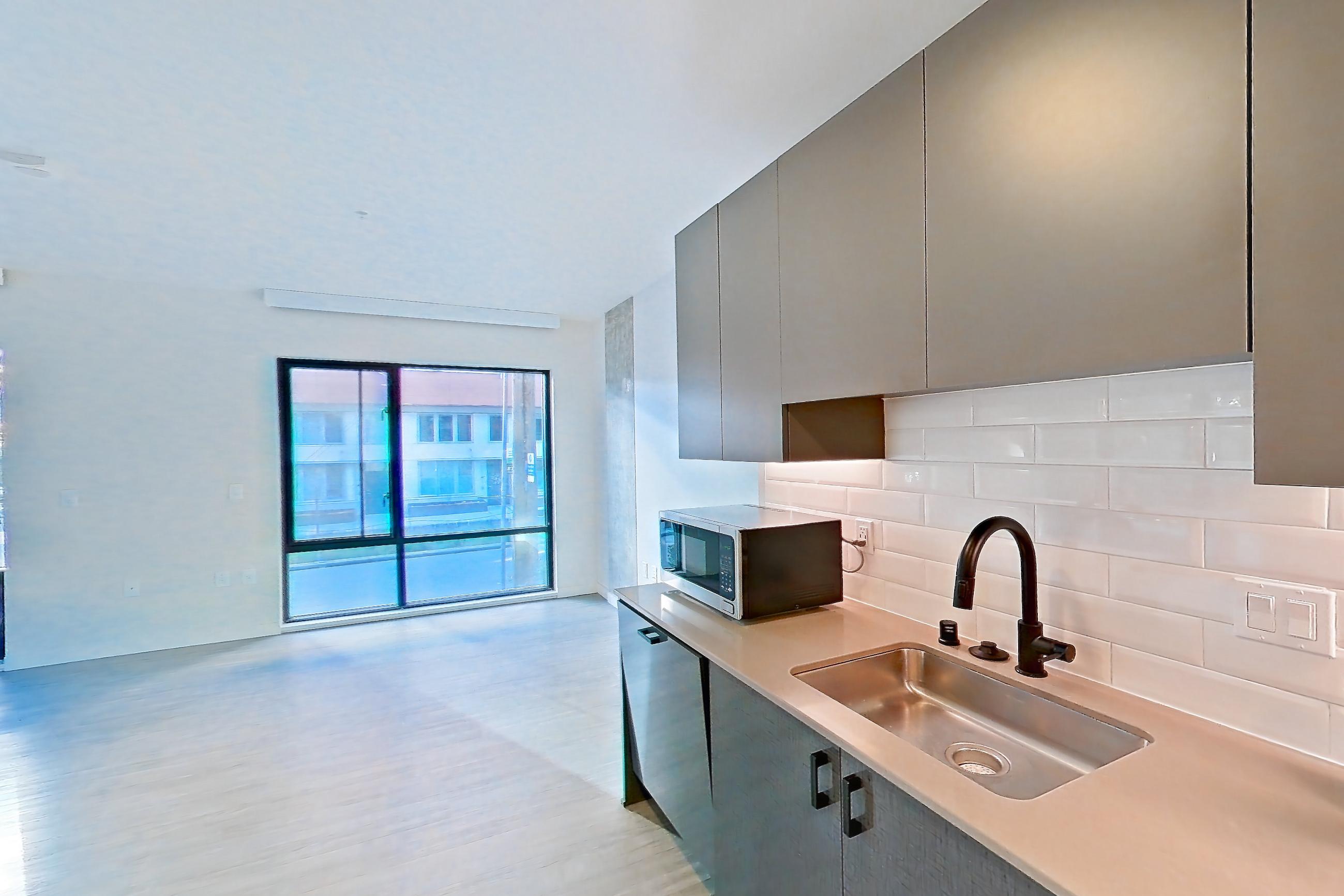 Kitchen in a A7 floor plan unit, representative of Unit 405 at Chroma