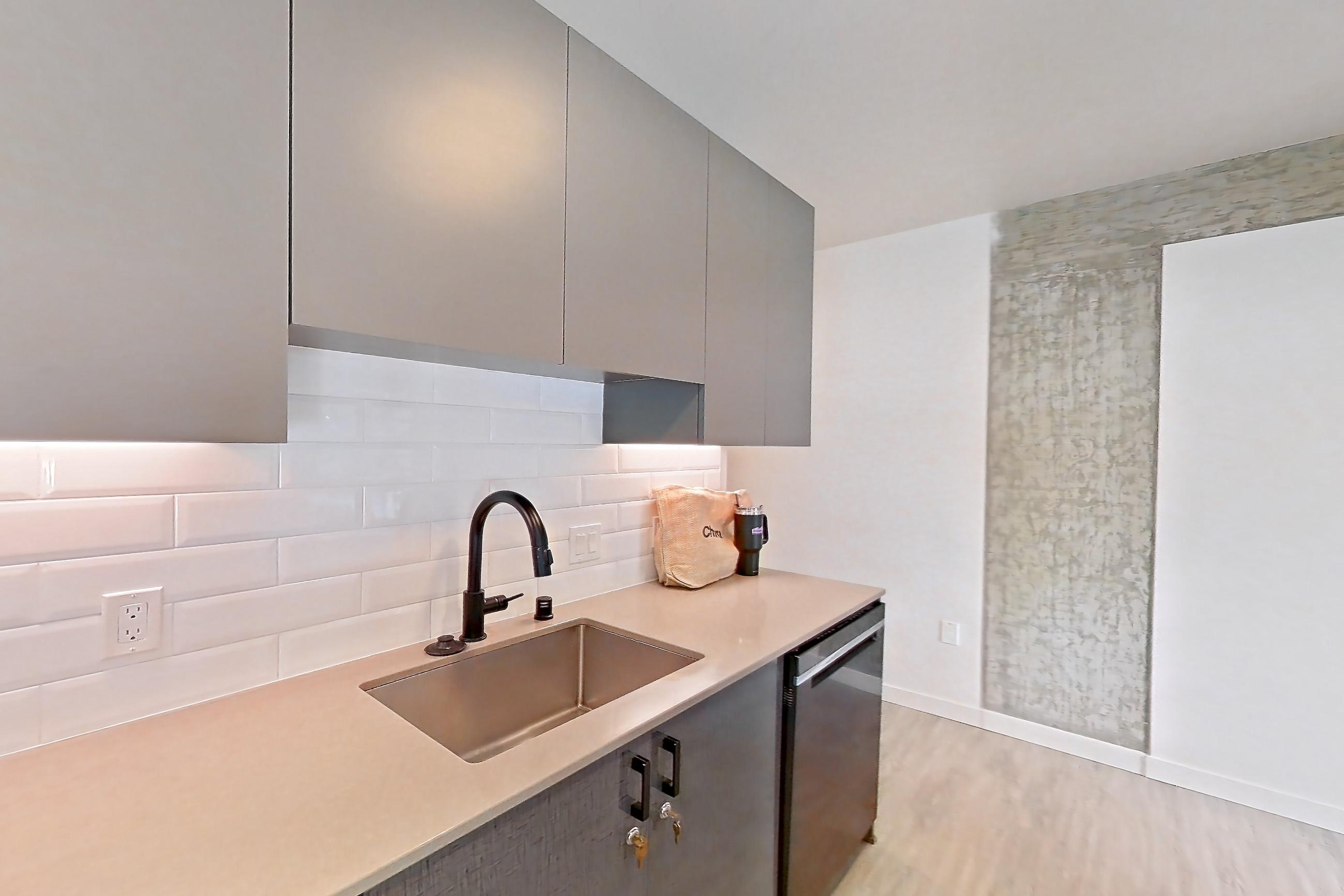 Kitchen in a B4 floor plan unit, representative of Unit 213 at Chroma