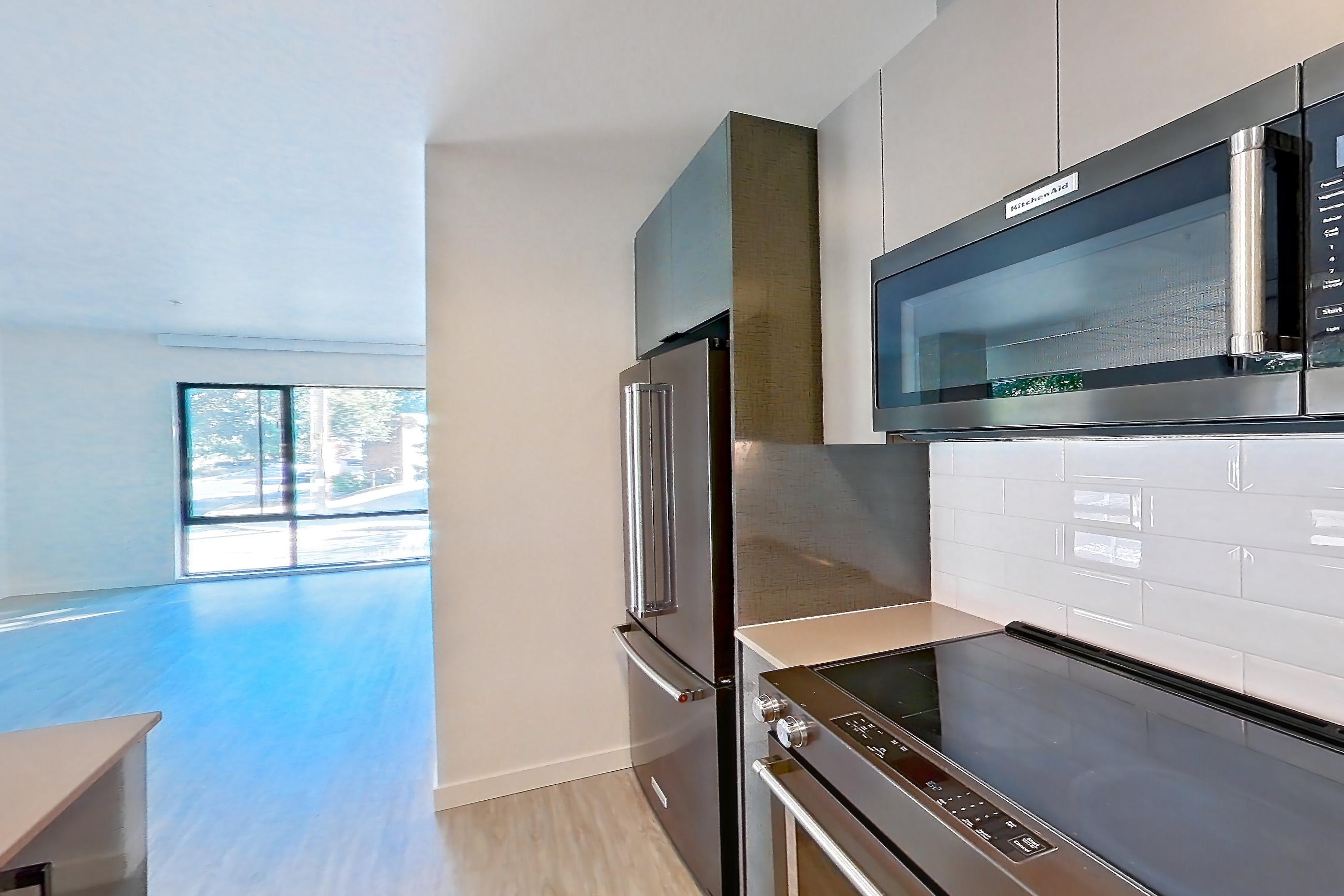 Kitchen in a B4 floor plan unit, representative of Unit 213 at Chroma