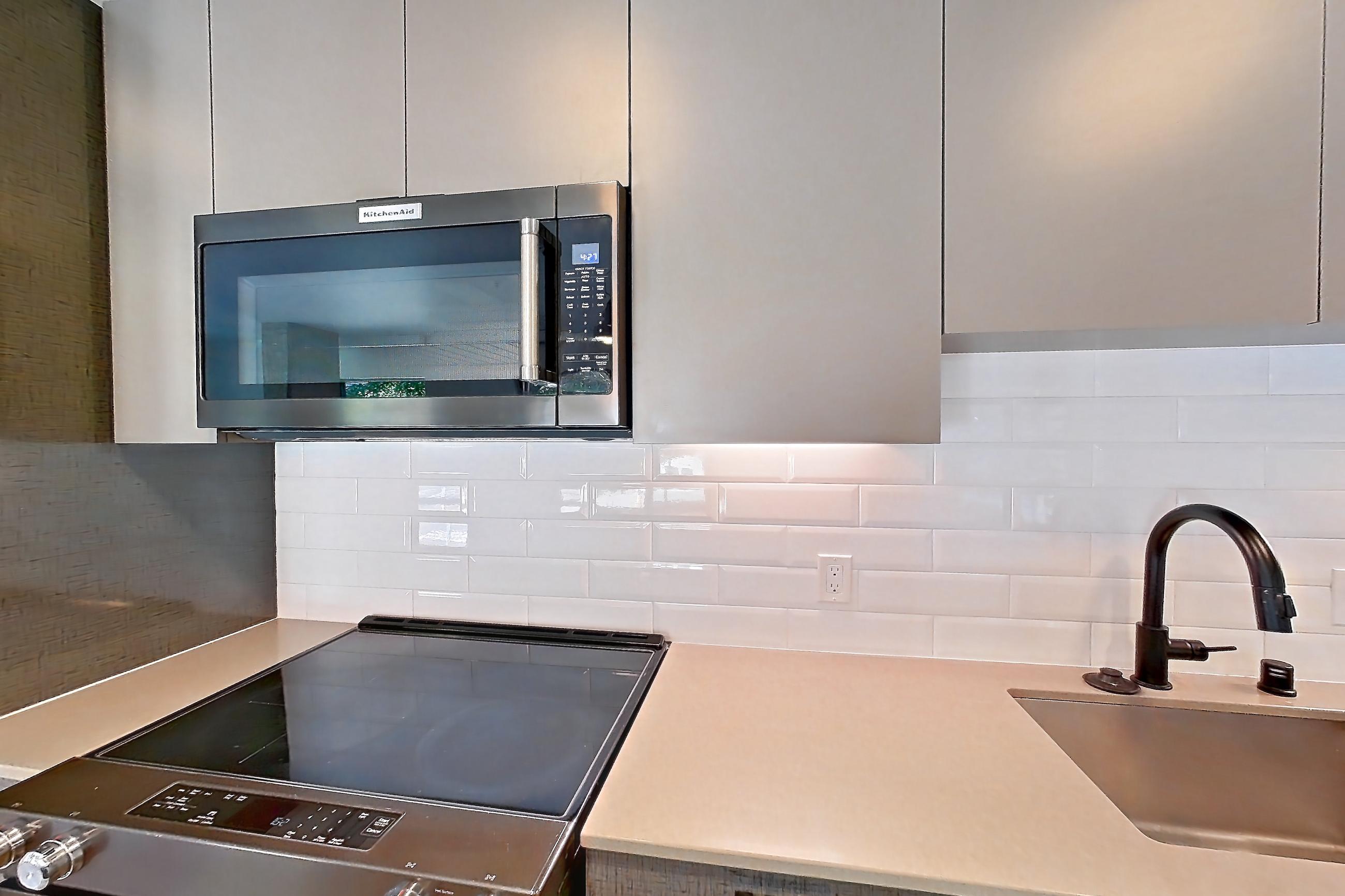 Kitchen in a B4 floor plan unit, representative of Unit 213 at Chroma