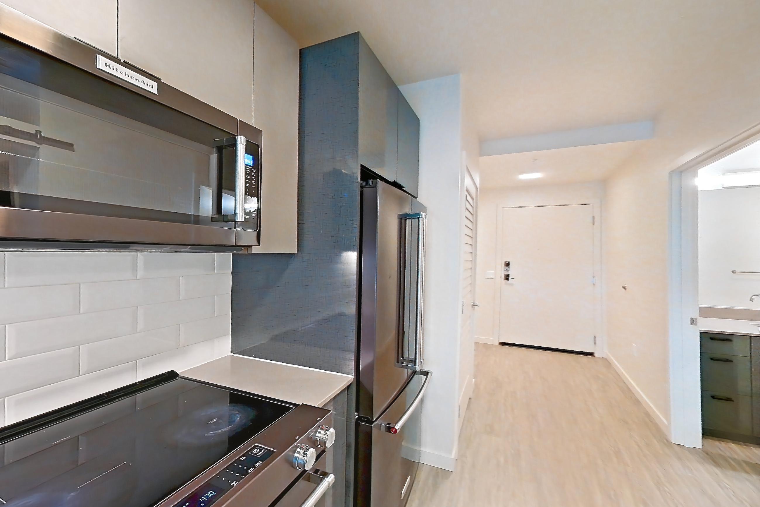 Kitchen in a U1 floor plan unit, representative of Unit 413W at Chroma