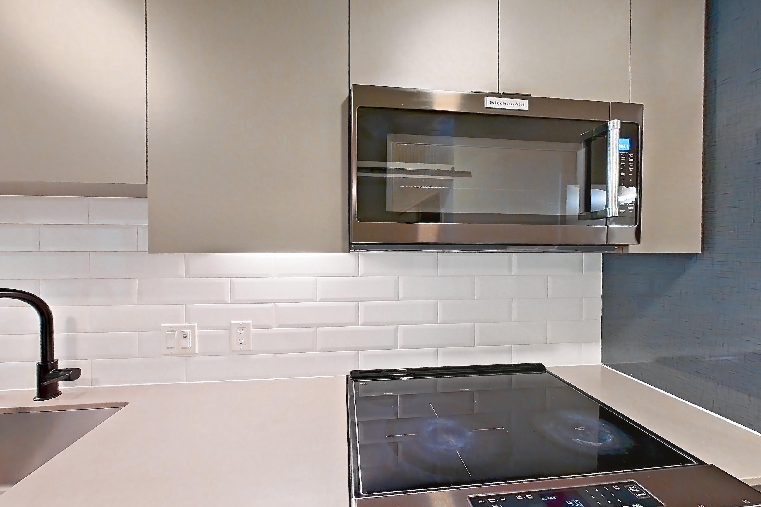 Kitchen in a U1 floor plan unit, representative of Unit 413W at Chroma