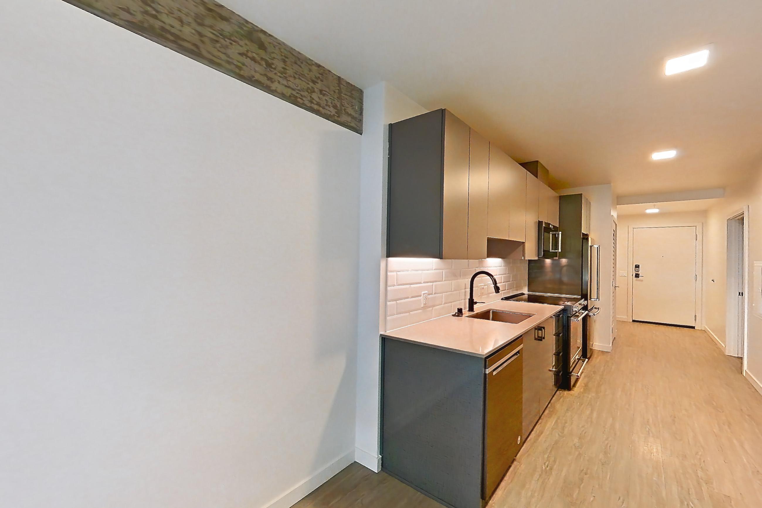 Living room in a U1 floor plan unit, representative of Unit 413W at Chroma