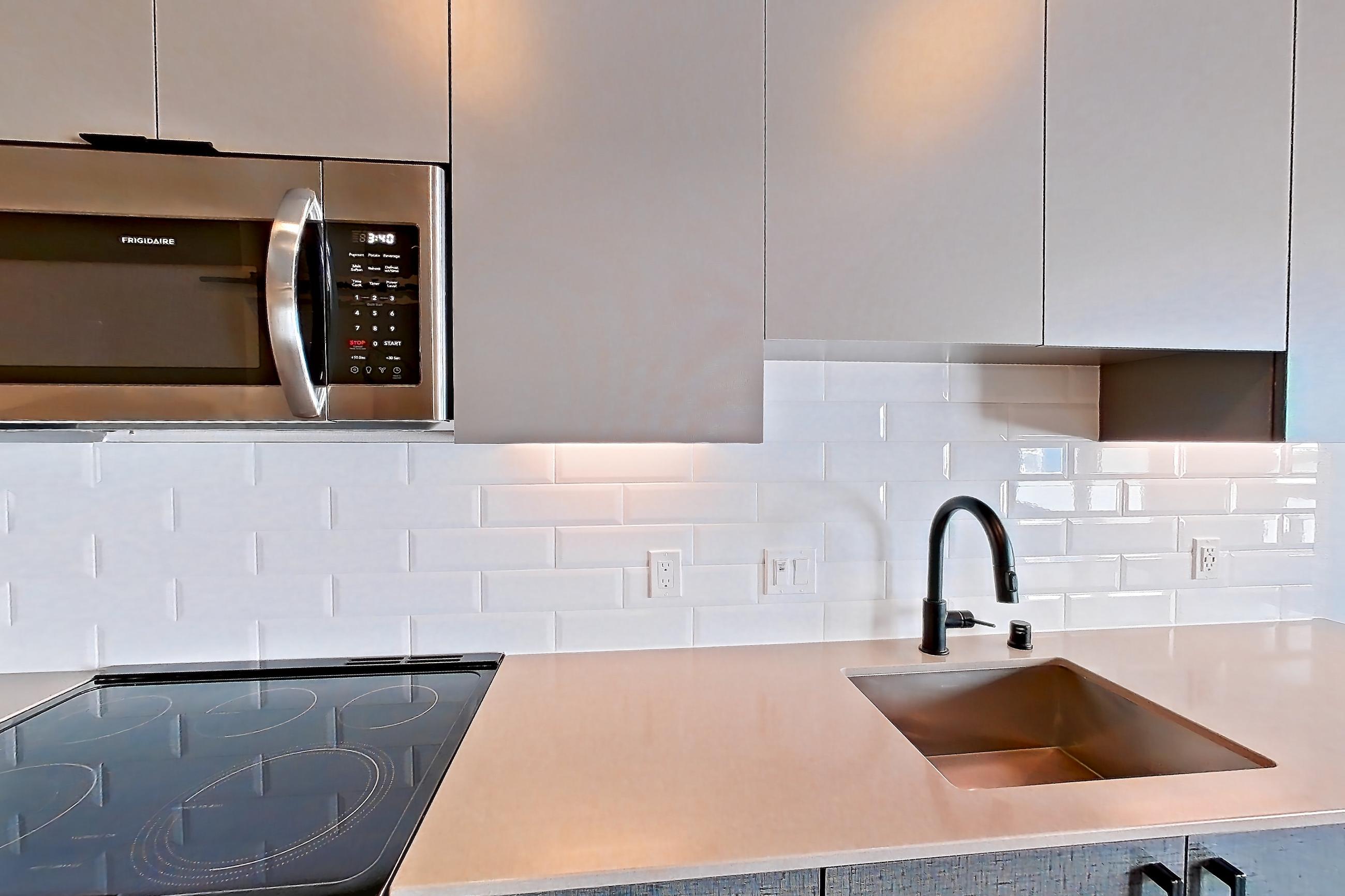 Kitchen in a U1 Furnished floor plan unit, representative of Unit 416 at Chroma