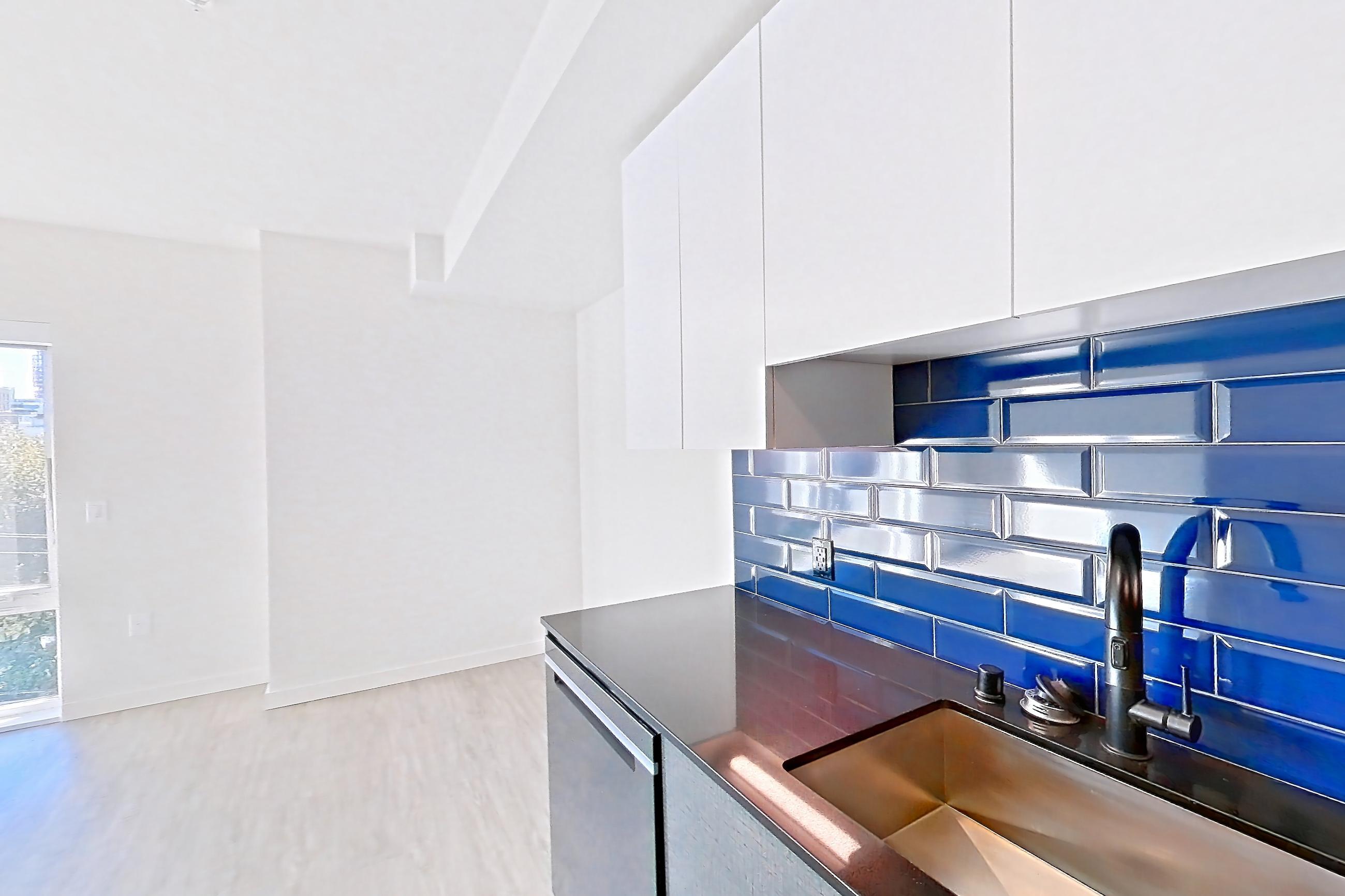 Kitchen in a U1 MFTE floor plan unit, representative of Unit 617W at Chroma