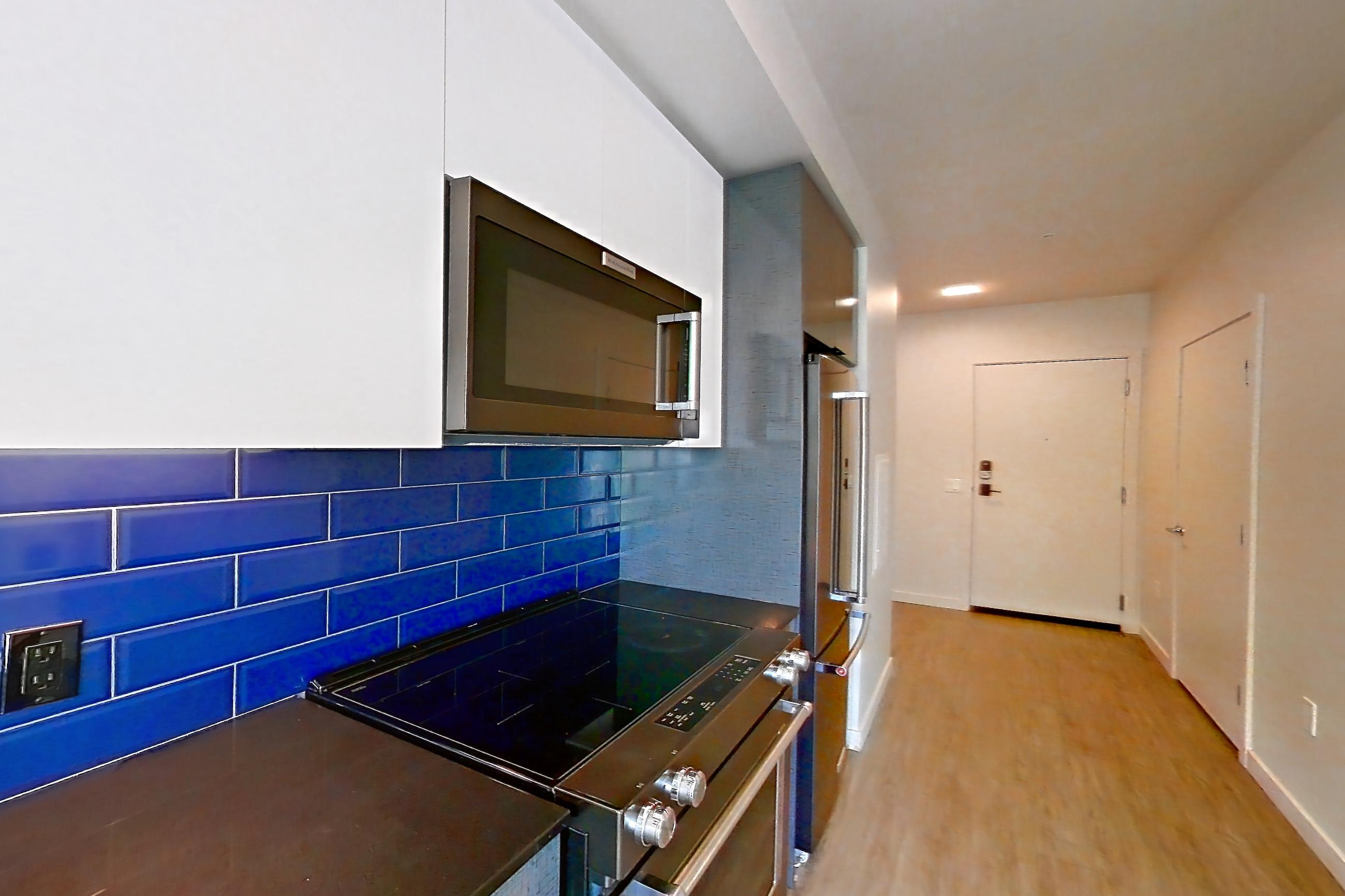Kitchen in a U1 MFTE floor plan unit, representative of Unit 617W at Chroma