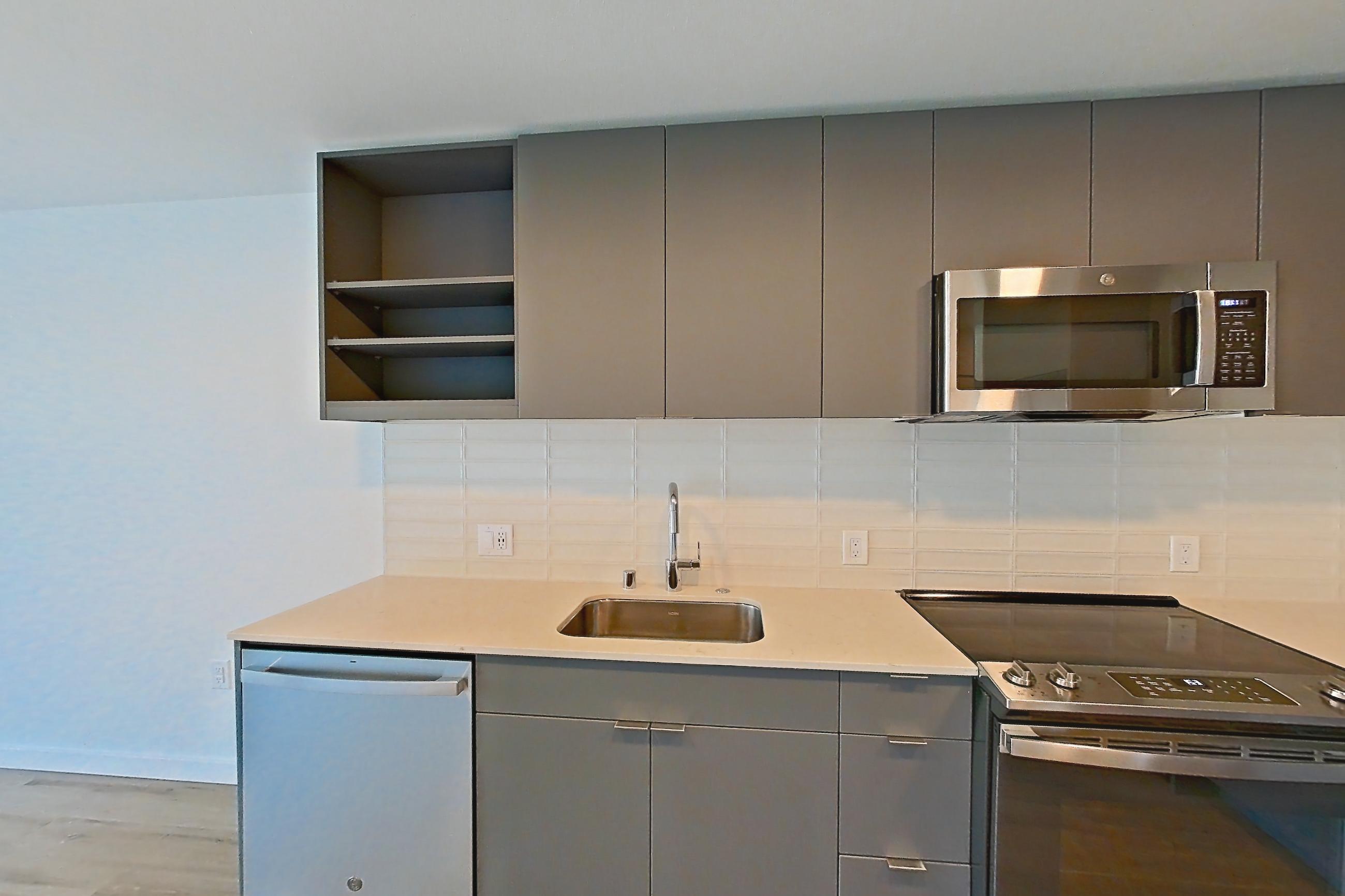 Kitchen in a A1 floor plan unit, representative of Unit 480 at Arlo