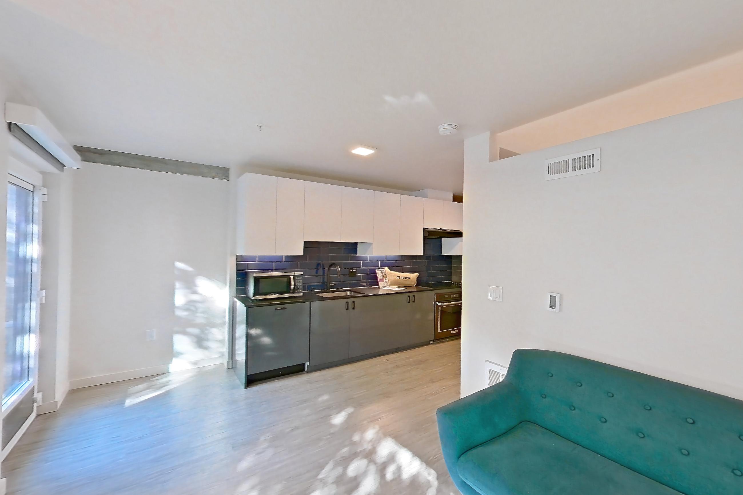 Living room in a U9 floor plan unit, representative of Unit 511 at Chroma