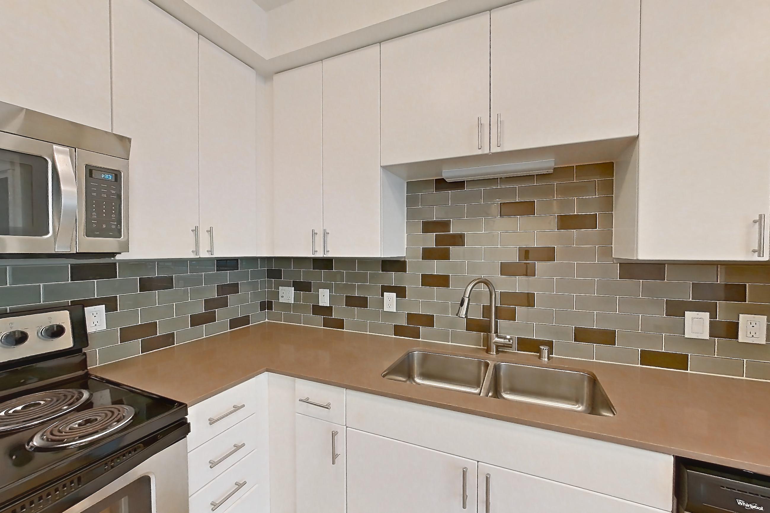 Kitchen in a S2 floor plan unit, representative of Unit 301 at The Waymark