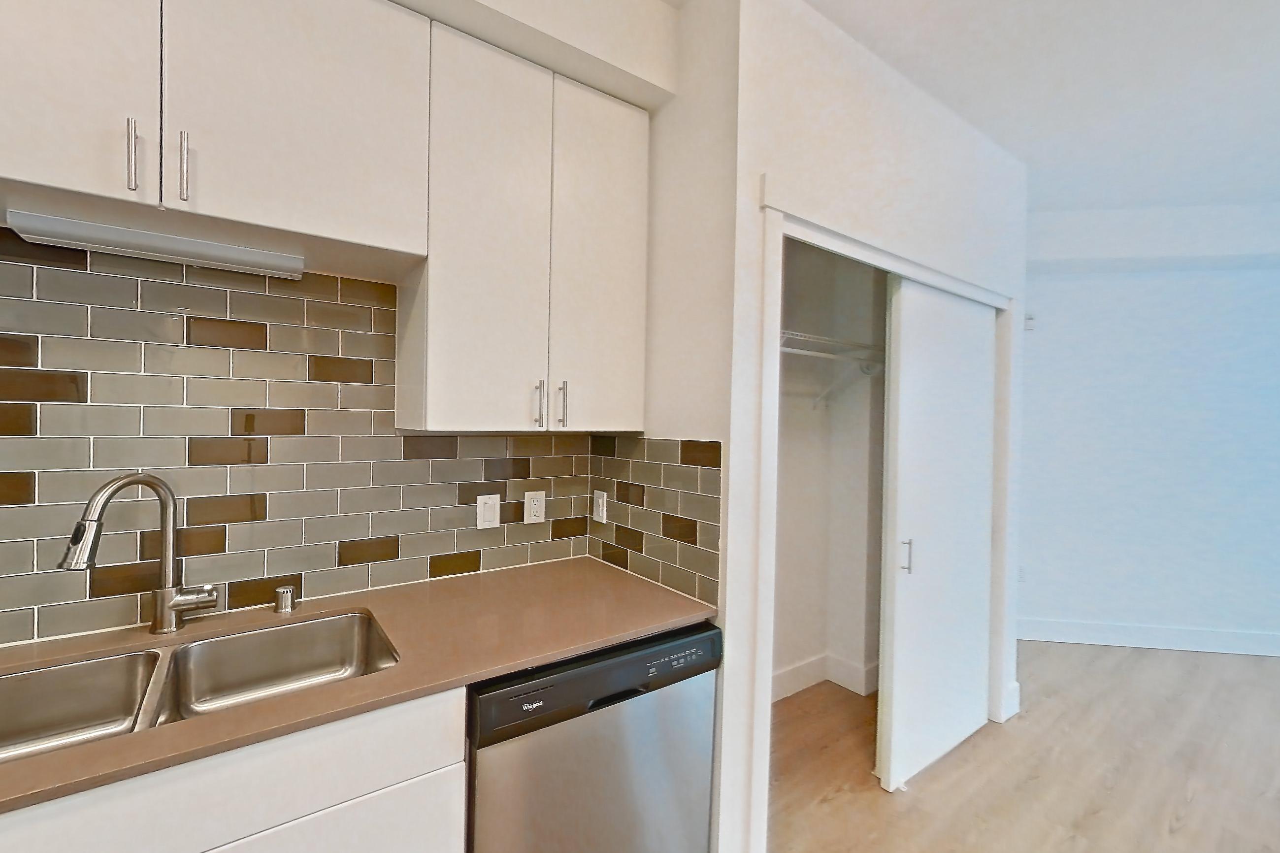 Kitchen in a S2 floor plan unit, representative of Unit 301 at The Waymark