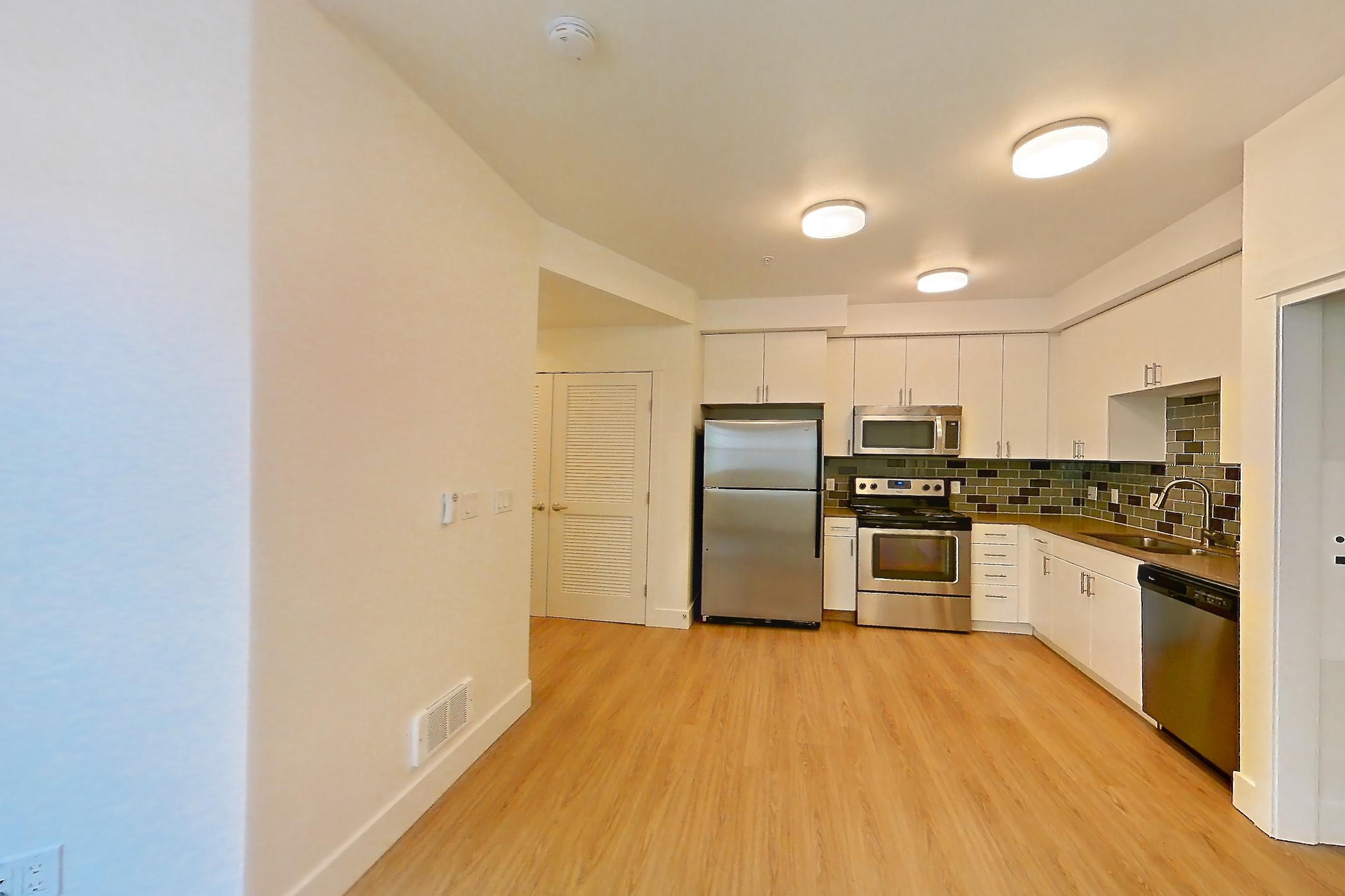 Living room in a S2 floor plan unit, representative of Unit 301 at The Waymark