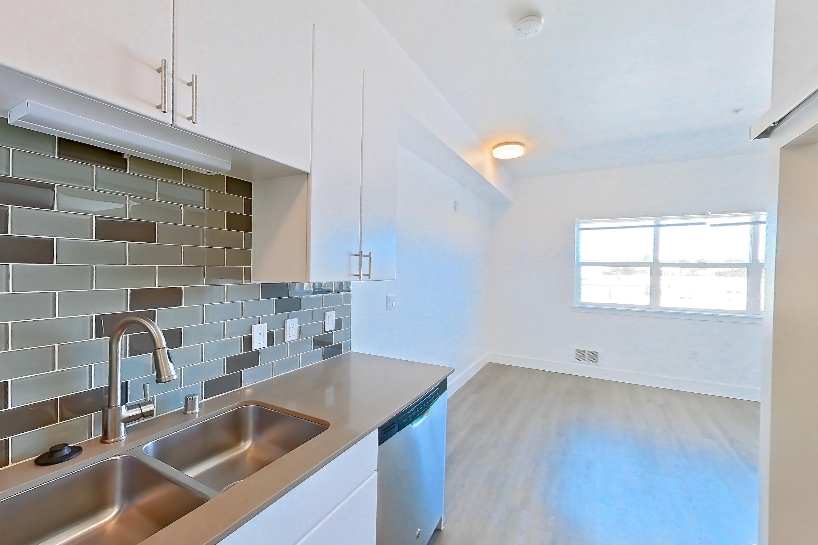 Kitchen in a UA2 floor plan unit, representative of Unit 425 at The Waymark