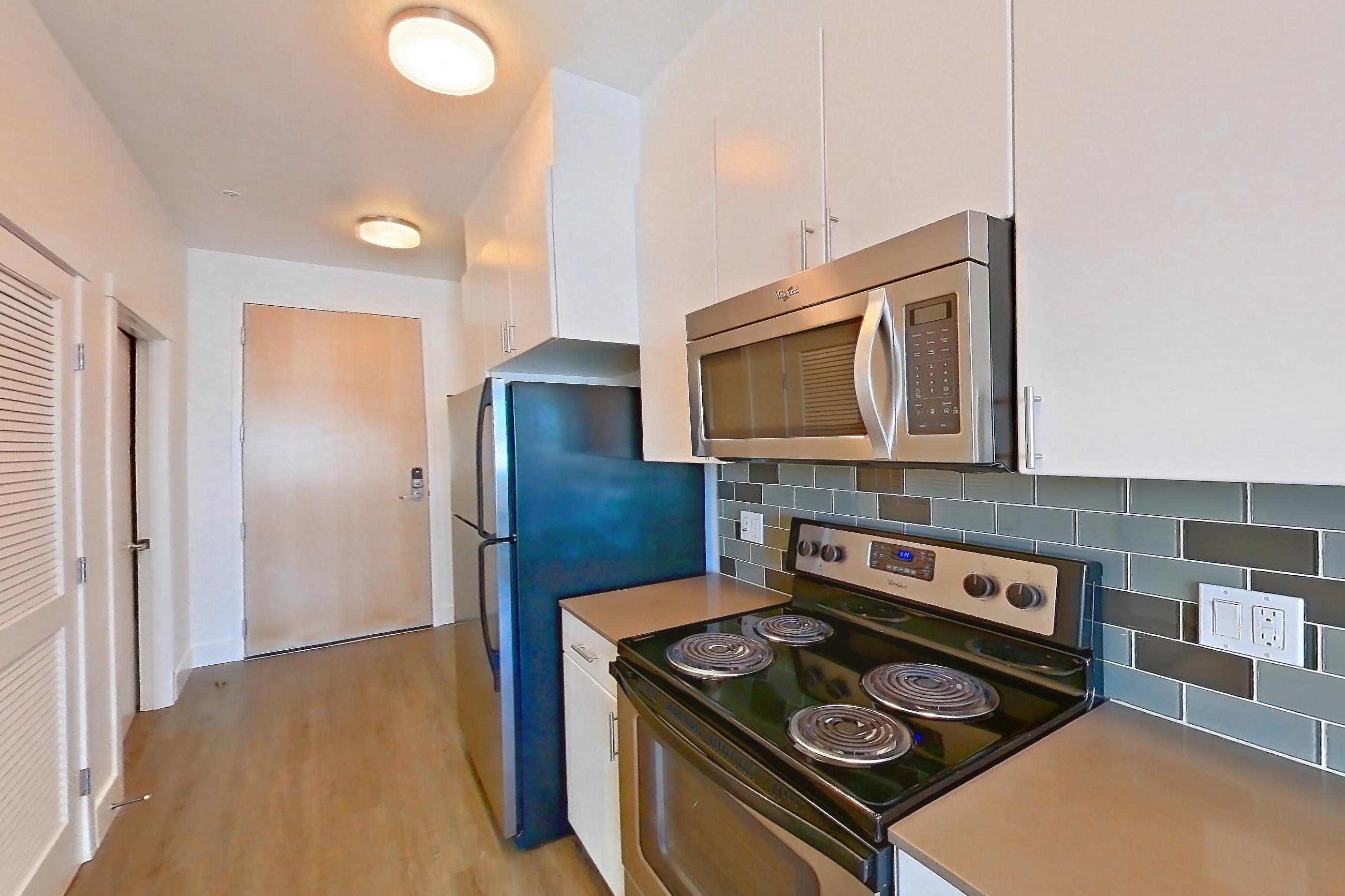 Kitchen in a UA2 floor plan unit, representative of Unit 425 at The Waymark