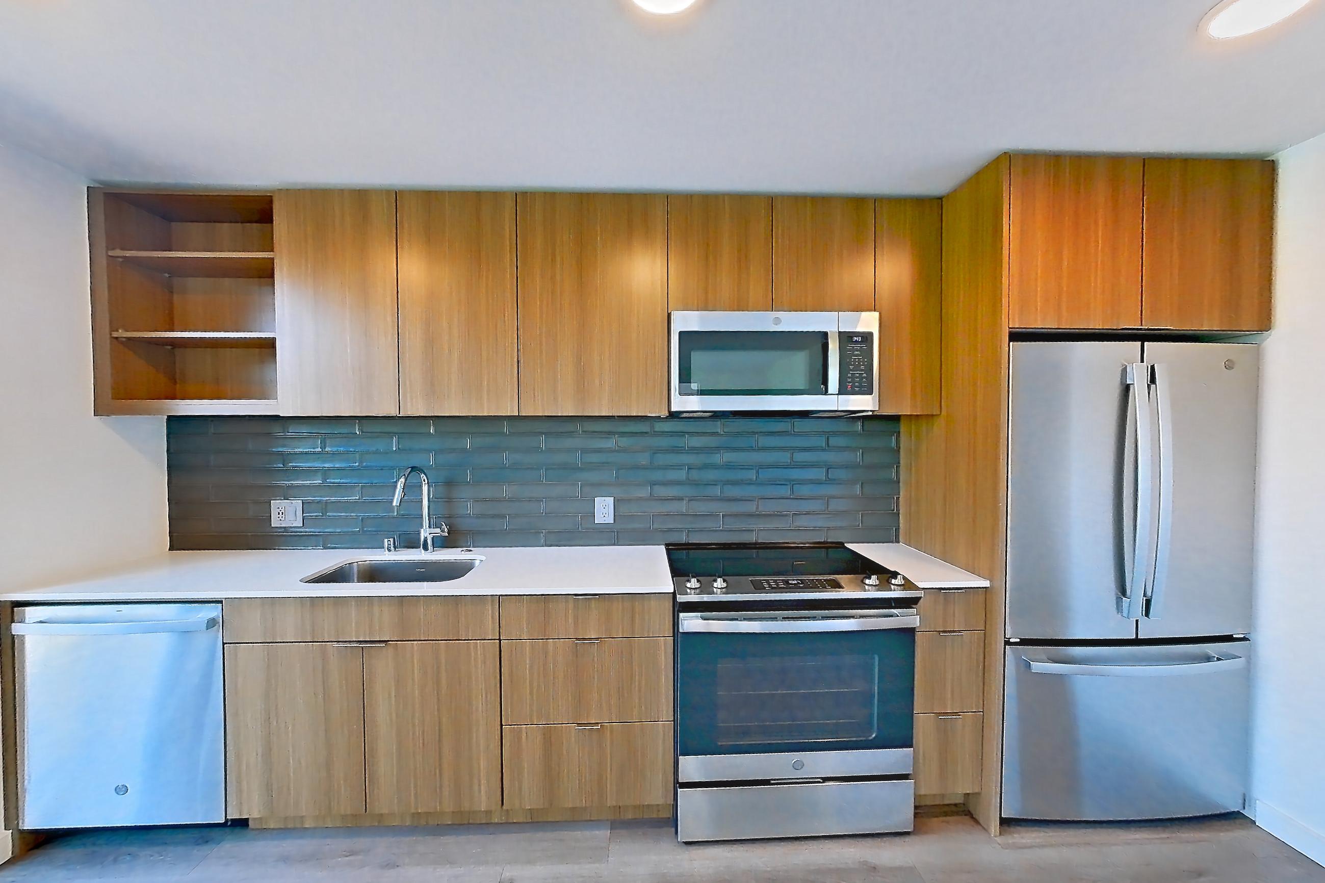 Kitchen in a C1.2 floor plan unit, representative of Unit 145 at Arlo