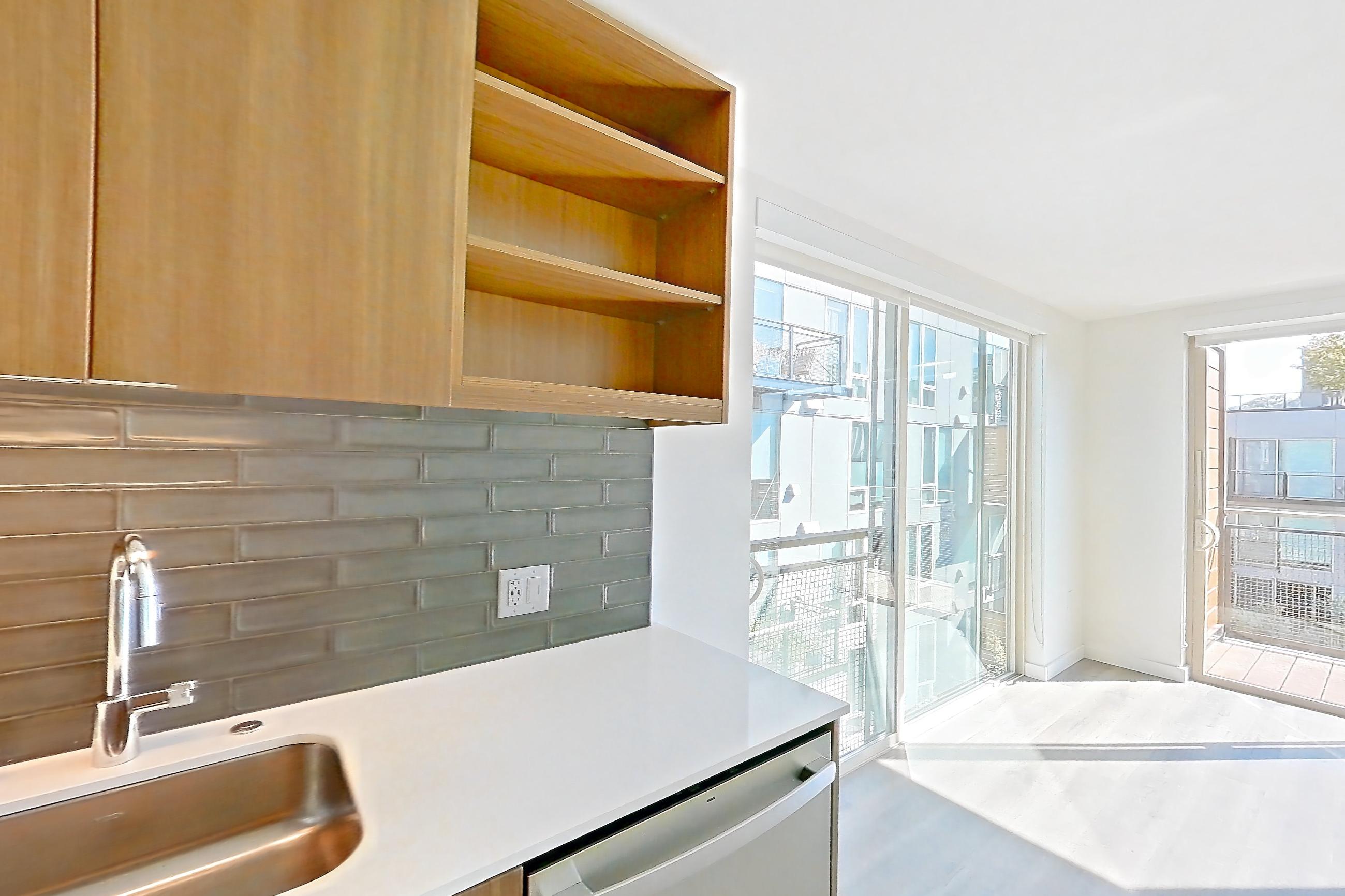 Kitchen in a C6 floor plan unit, representative of Unit 383 at Arlo