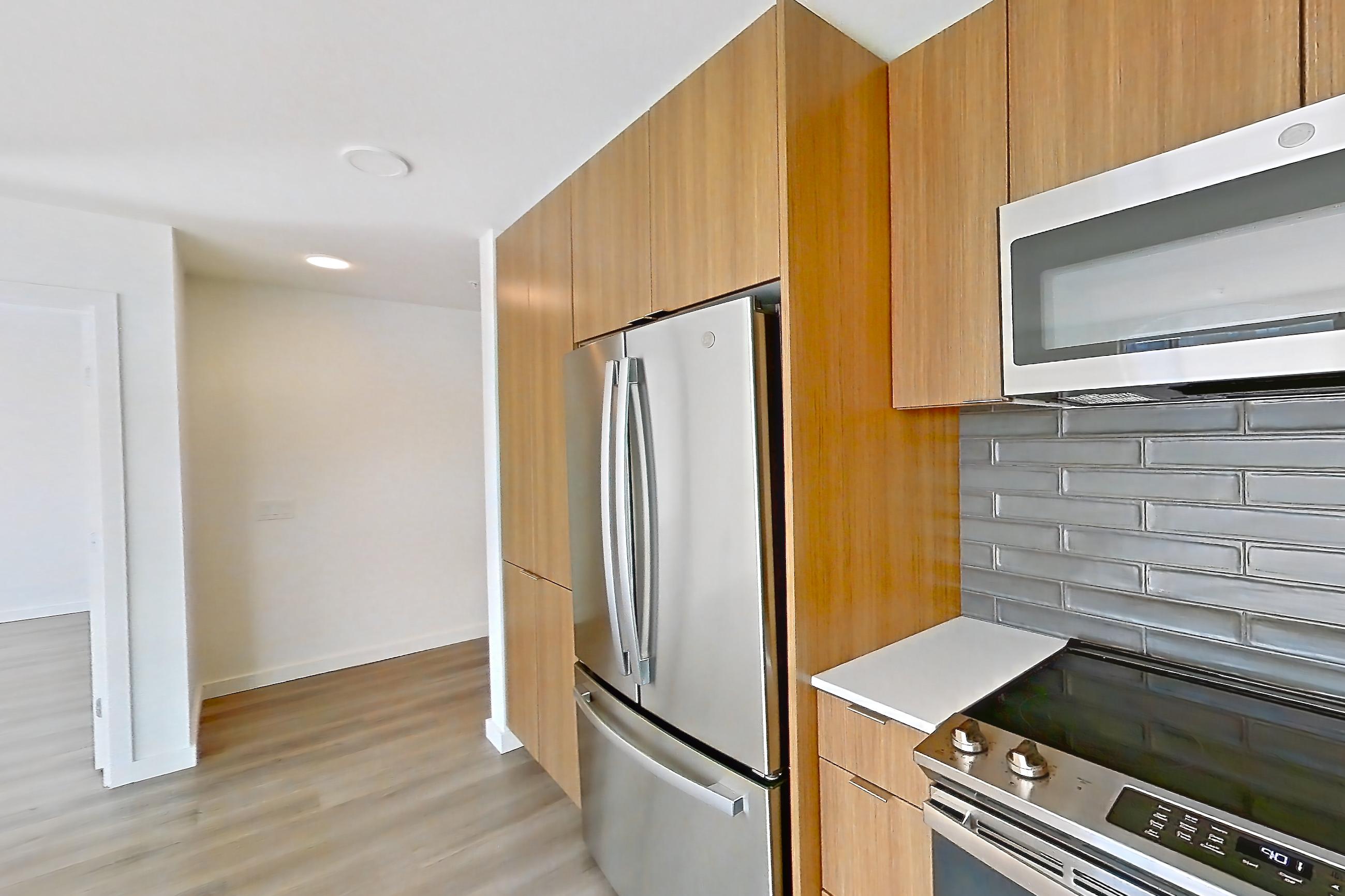 Kitchen in a C6 floor plan unit, representative of Unit 383 at Arlo