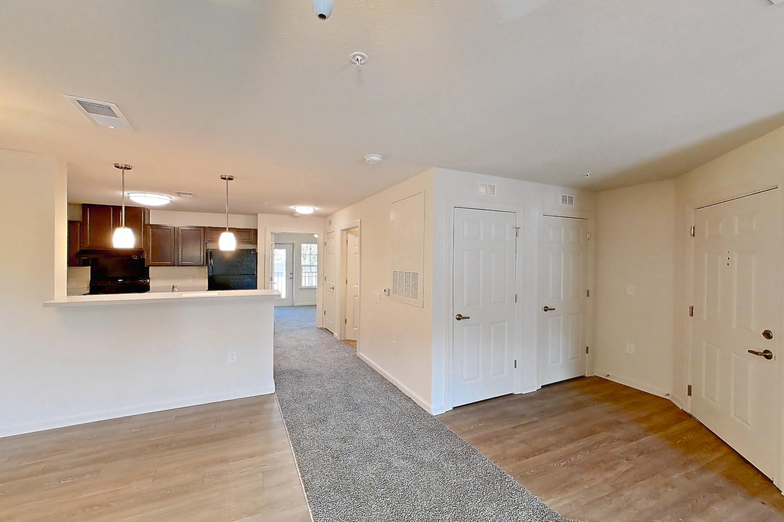 Living space with dark carpet, Apartment 10O at Springbrook