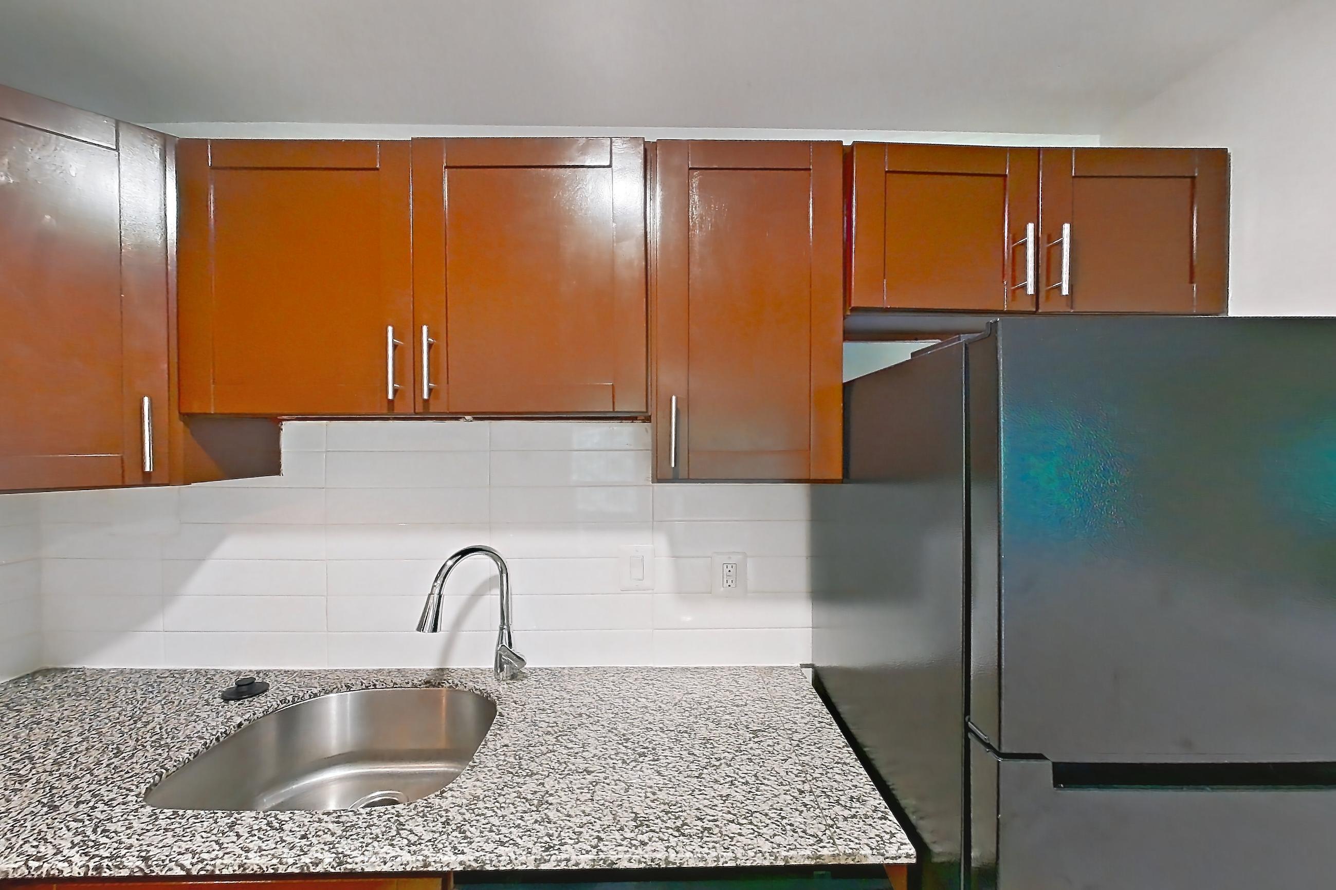 Kitchen in a One Bedroom One Bath with Den floor plan apartment, representative of Apartment 6005SD32 at Franklin Park at Greenbelt Station