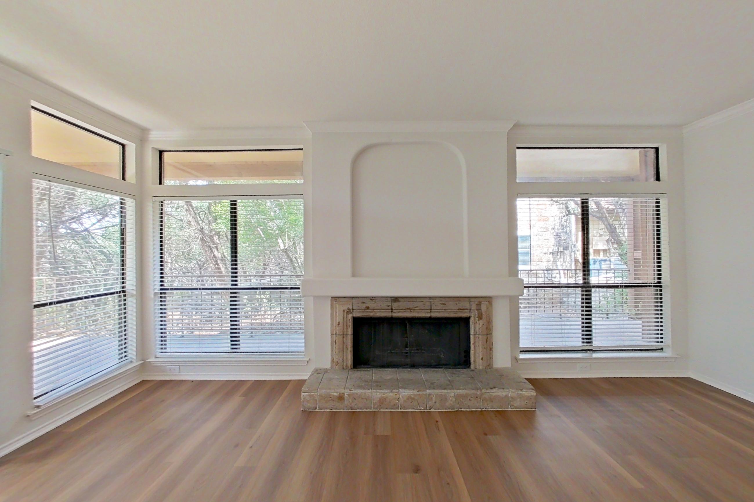 Living space with fireplace and tile fireplace, Apartment 2411 at Marquis at Caprock Canyon