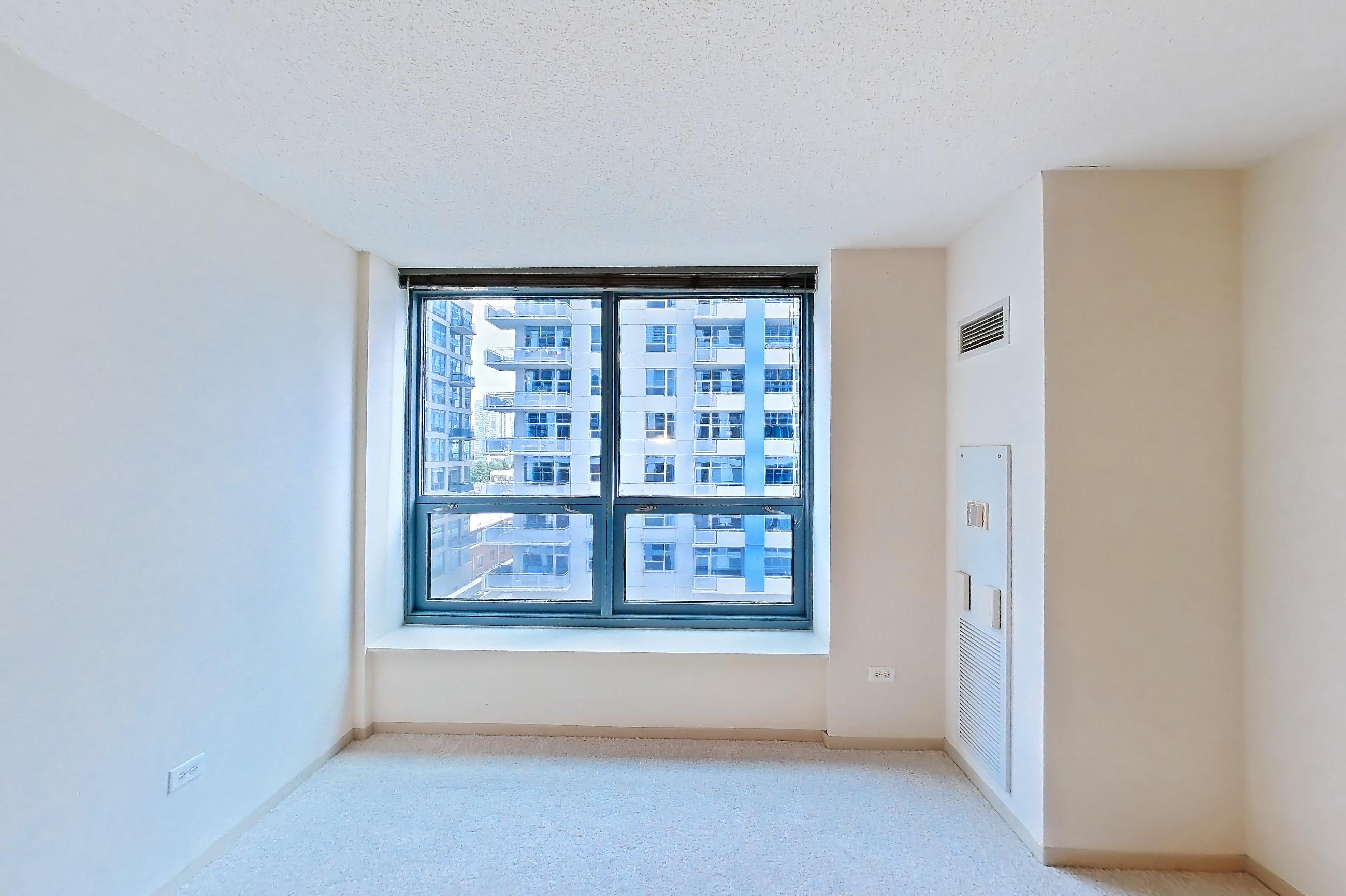 Living room with light carpet, Apartment 802 at Sky55