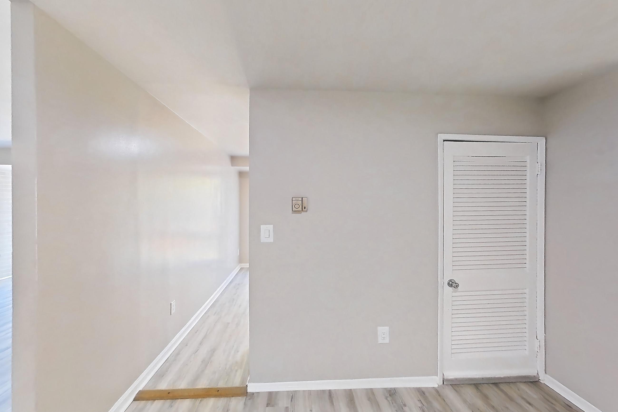 Dining room with light wood-finish flooring, Apartment 5807CL31 at Franklin Park at Greenbelt Station