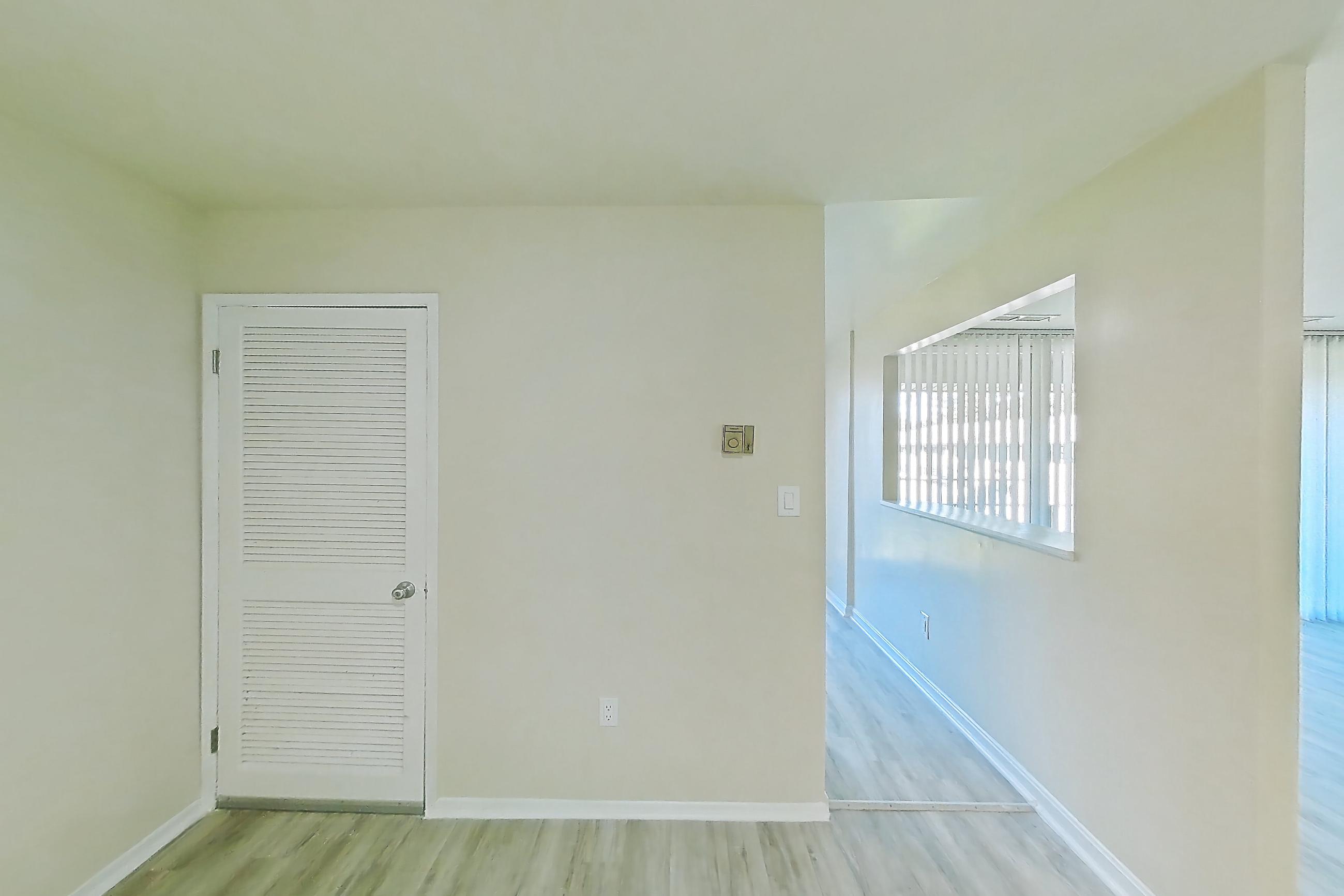 Dining room with light wood-finish flooring, Apartment 5807CT32 at Franklin Park at Greenbelt Station
