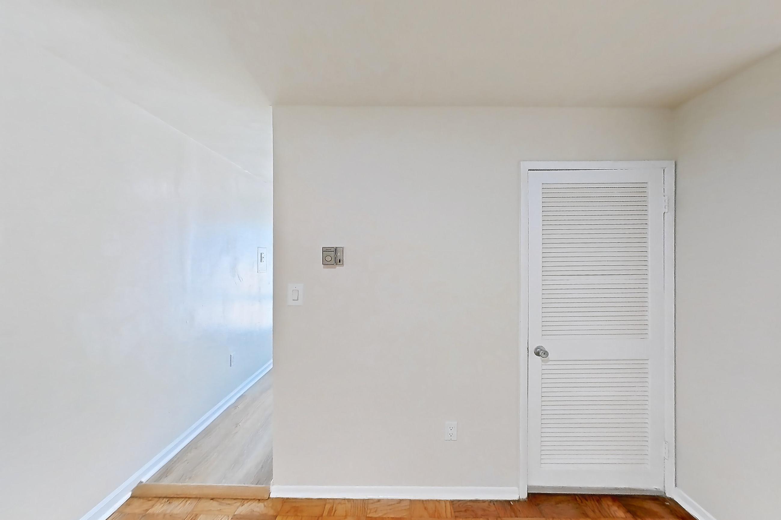 Dining room with light wood-finish flooring and parquet flooring, Apartment 5807CT33 at Franklin Park at Greenbelt Station