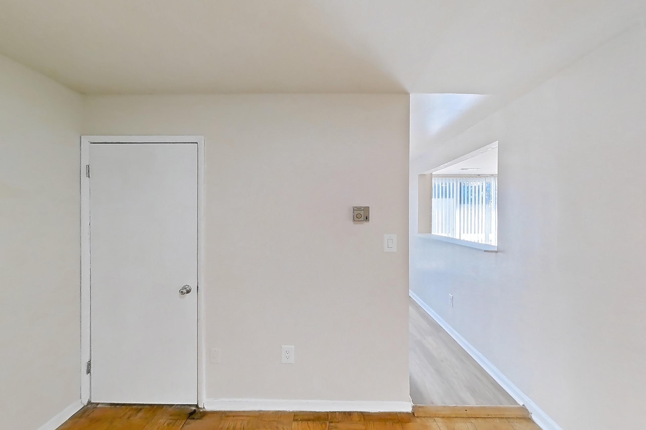 Dining room with light wood-finish flooring and parquet flooring, Apartment 5809CT24 at Franklin Park at Greenbelt Station