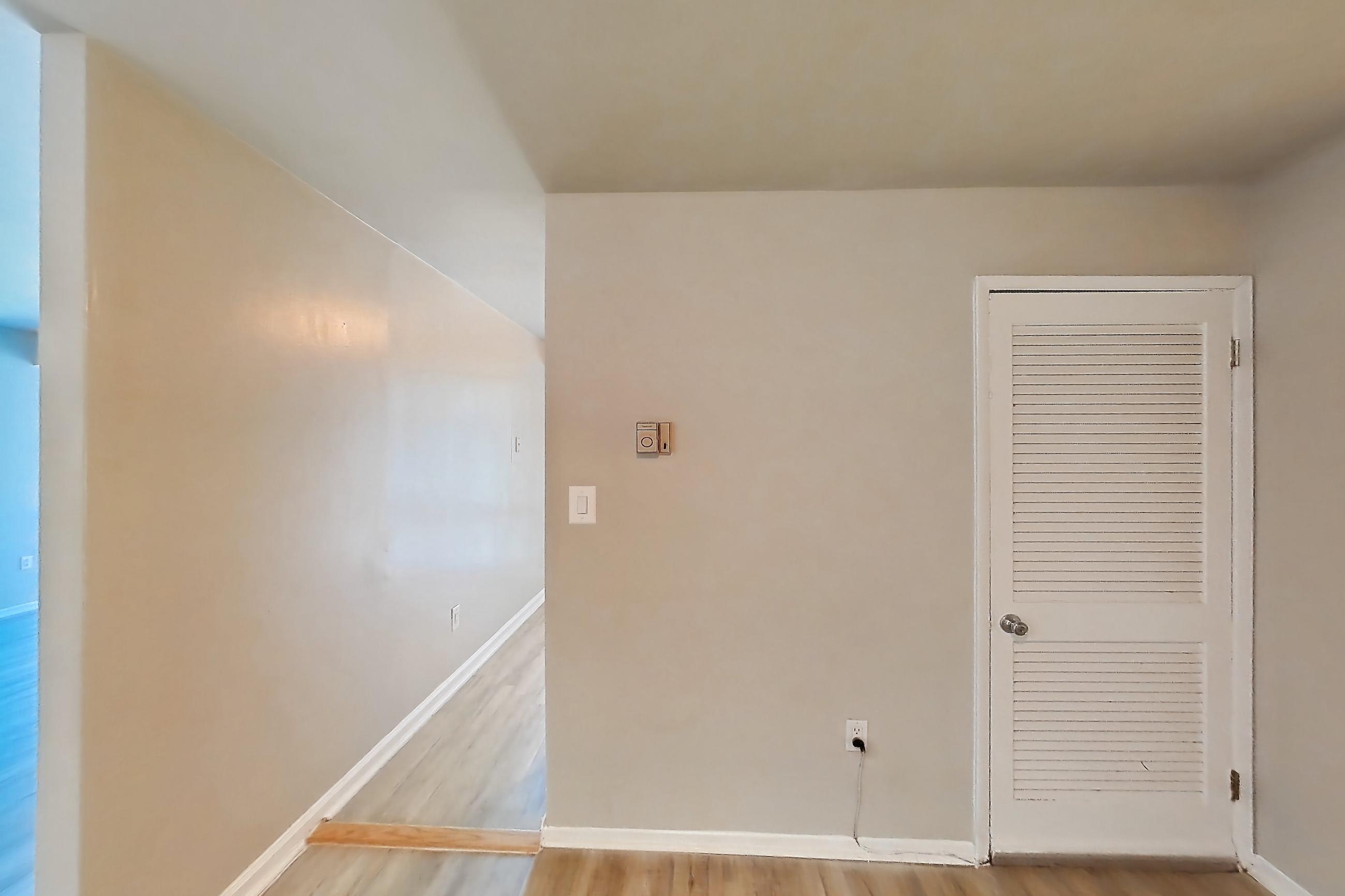 Dining room with light wood-finish flooring, Apartment 5811CL31 at Franklin Park at Greenbelt Station