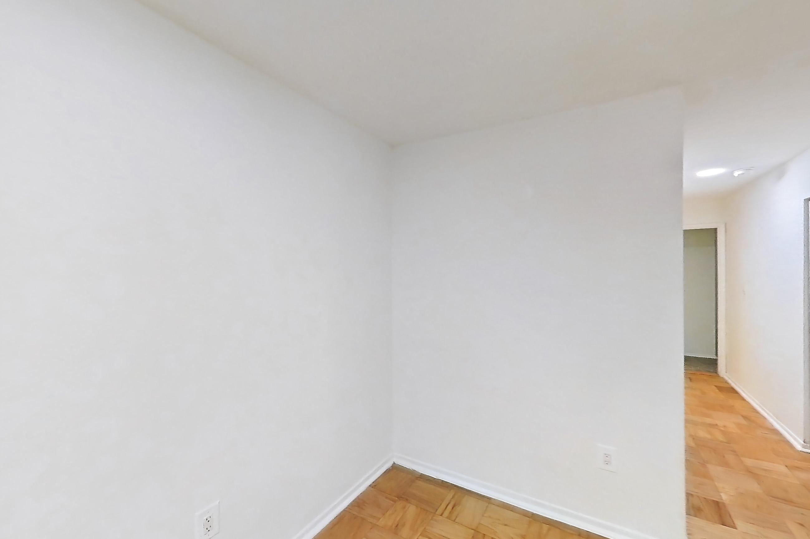 Dining room with light wood-finish flooring and parquet flooring, Apartment 5811CL34 at Franklin Park at Greenbelt Station