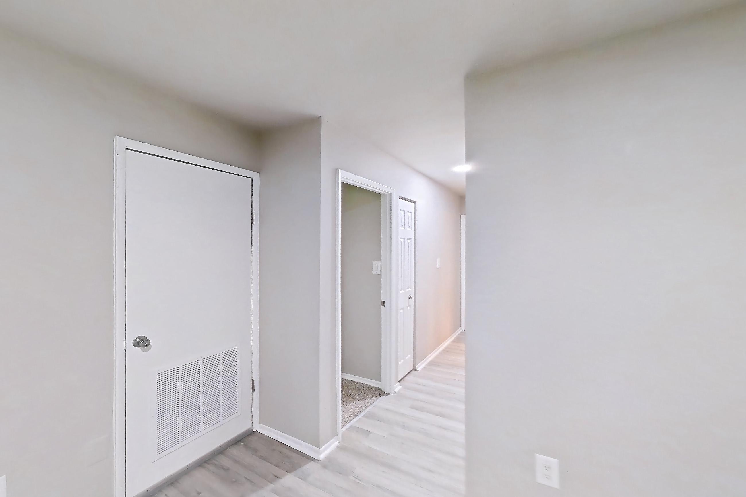 Dining room with light wood-finish flooring, Apartment 5811CT33 at Franklin Park at Greenbelt Station