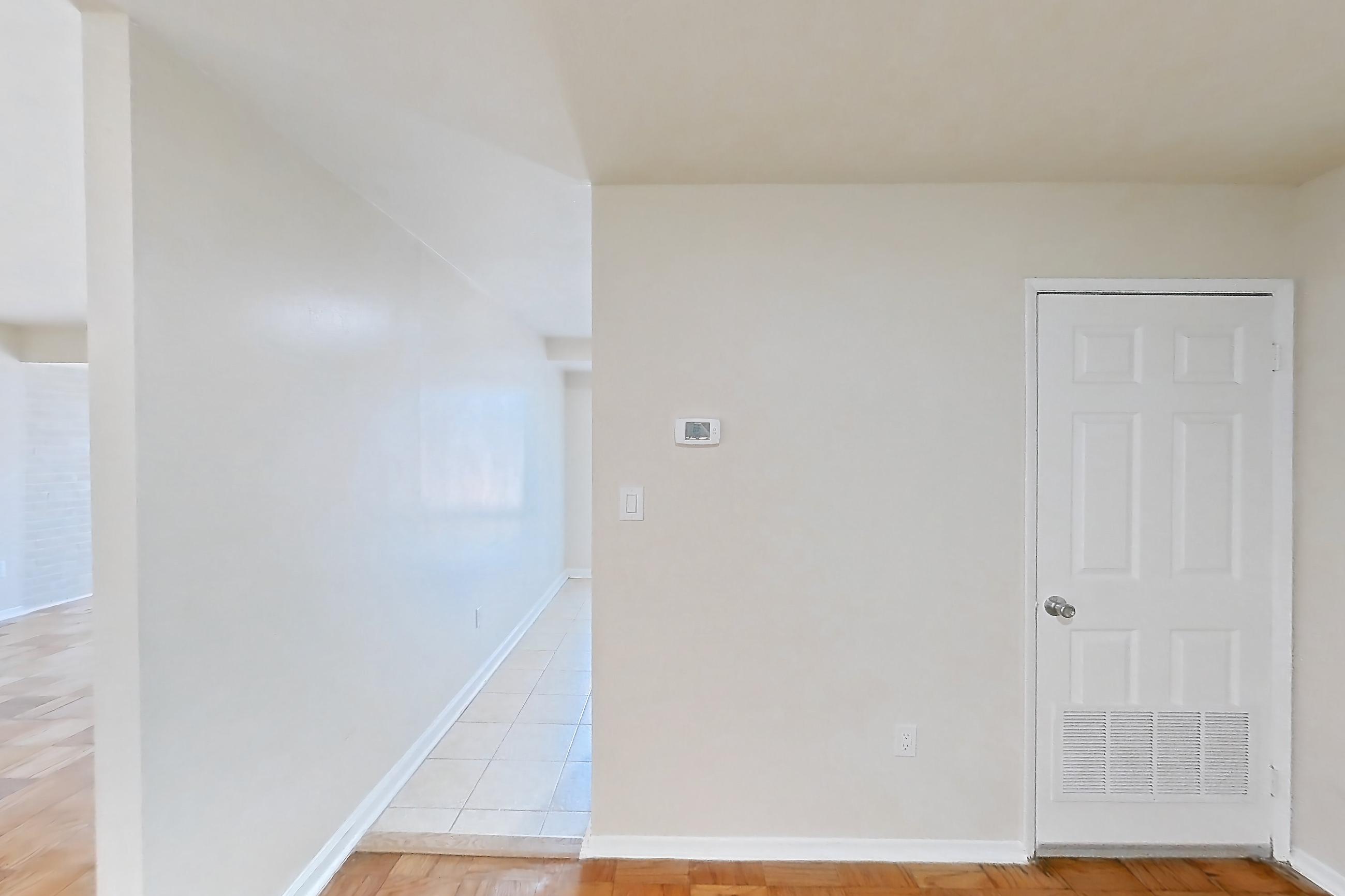 Dining room with light wood-finish flooring and parquet flooring, Apartment 5813CL31 at Franklin Park at Greenbelt Station
